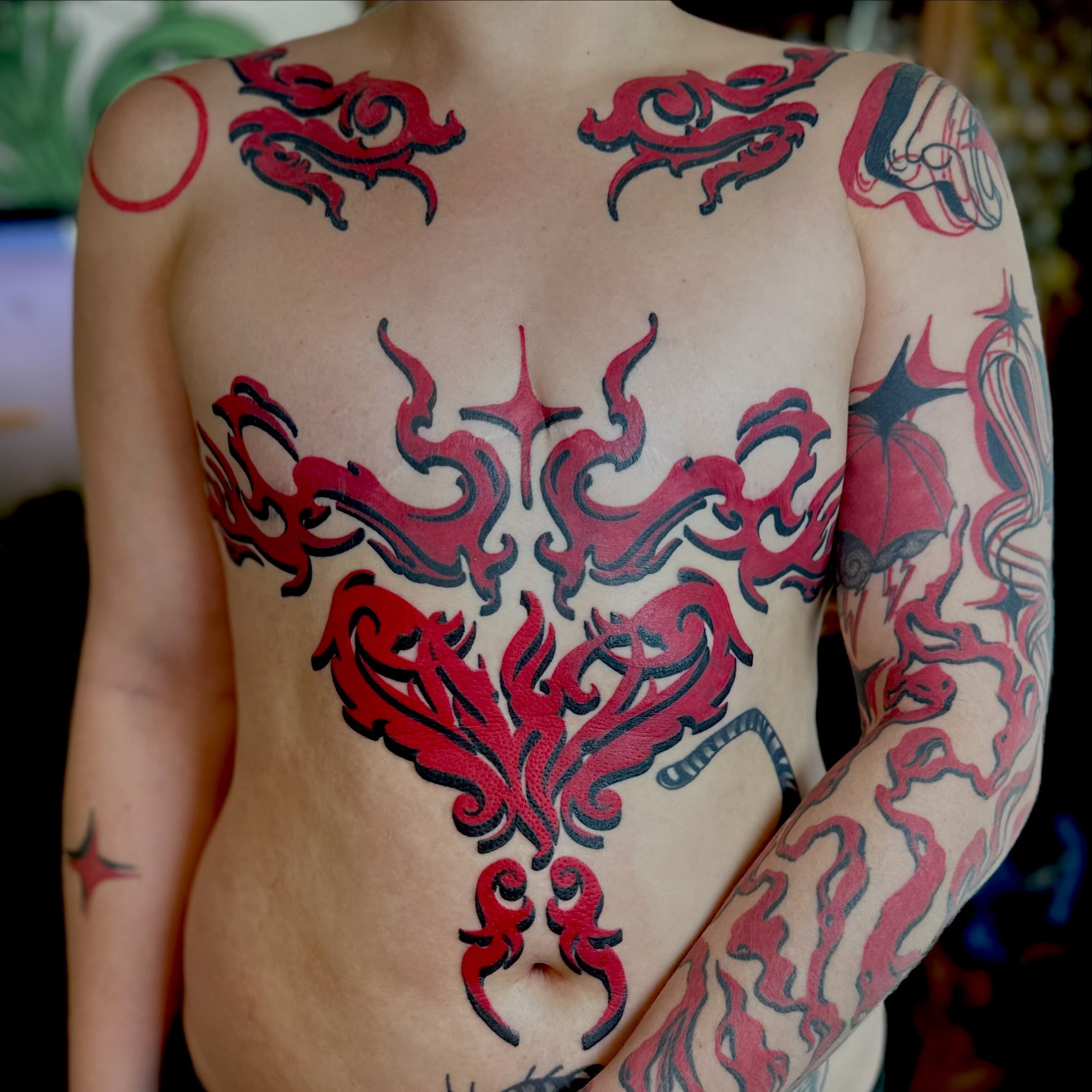 Flames tribal tattoo on the back by Leeuh Vandever