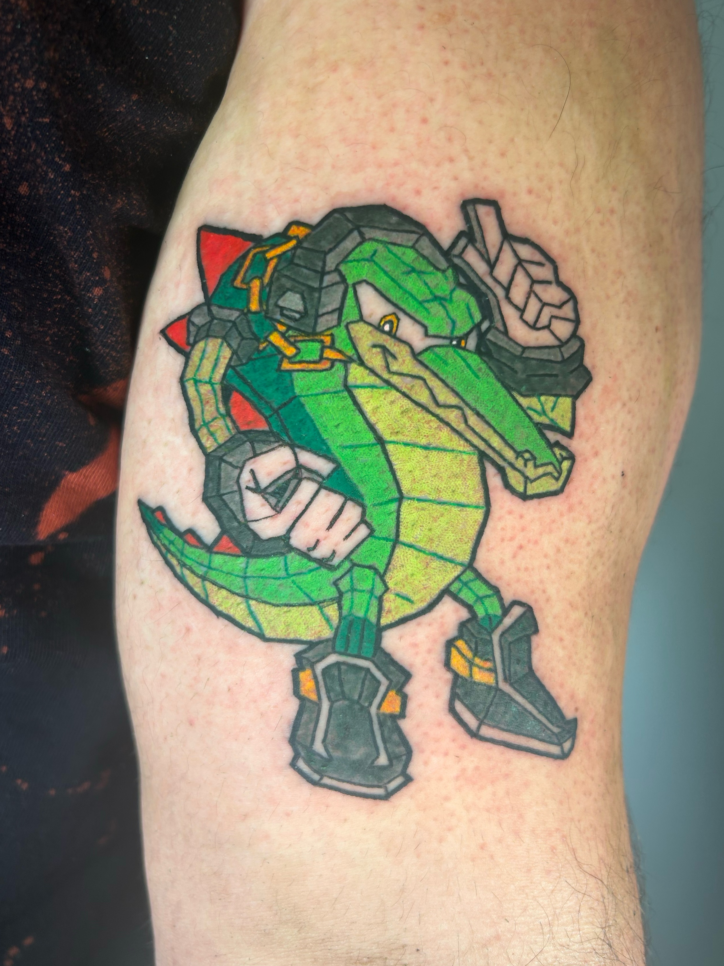 Mecha crocodile geometric tattoo on the forearm by Ollie