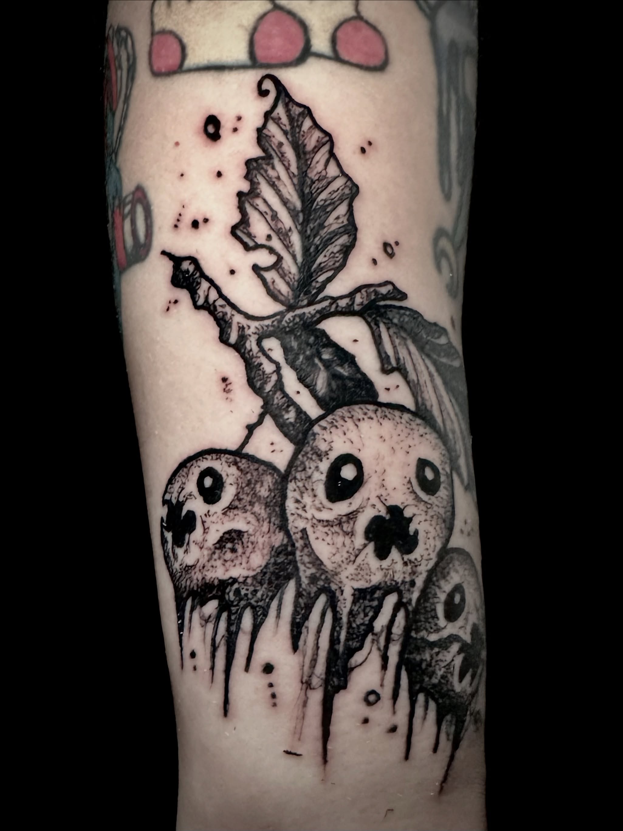 Melting skulls dark realism tattoo on the forearm by Noah Durany