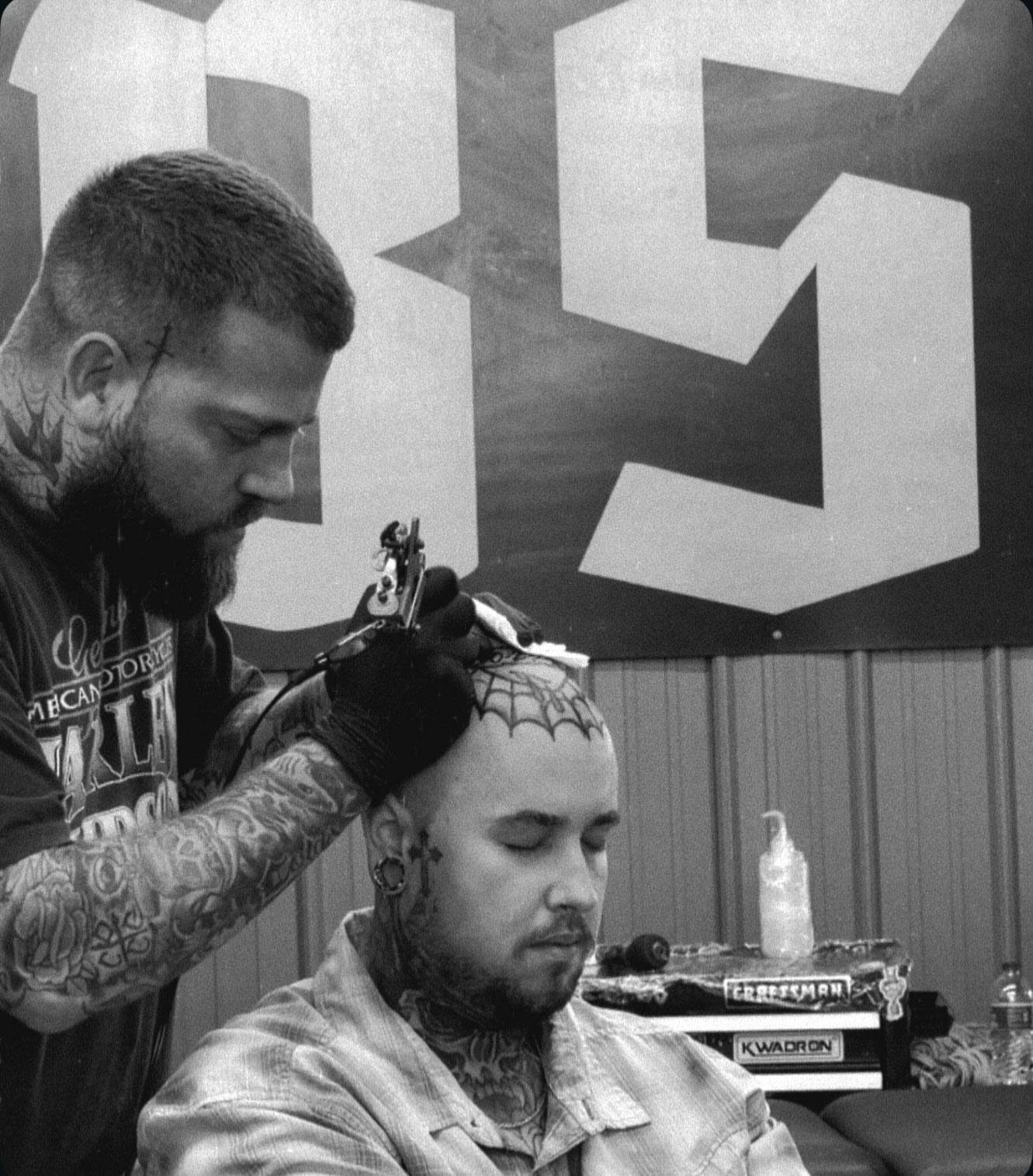 Spider web black and grey tattoo on the head by Dylan O'Quin