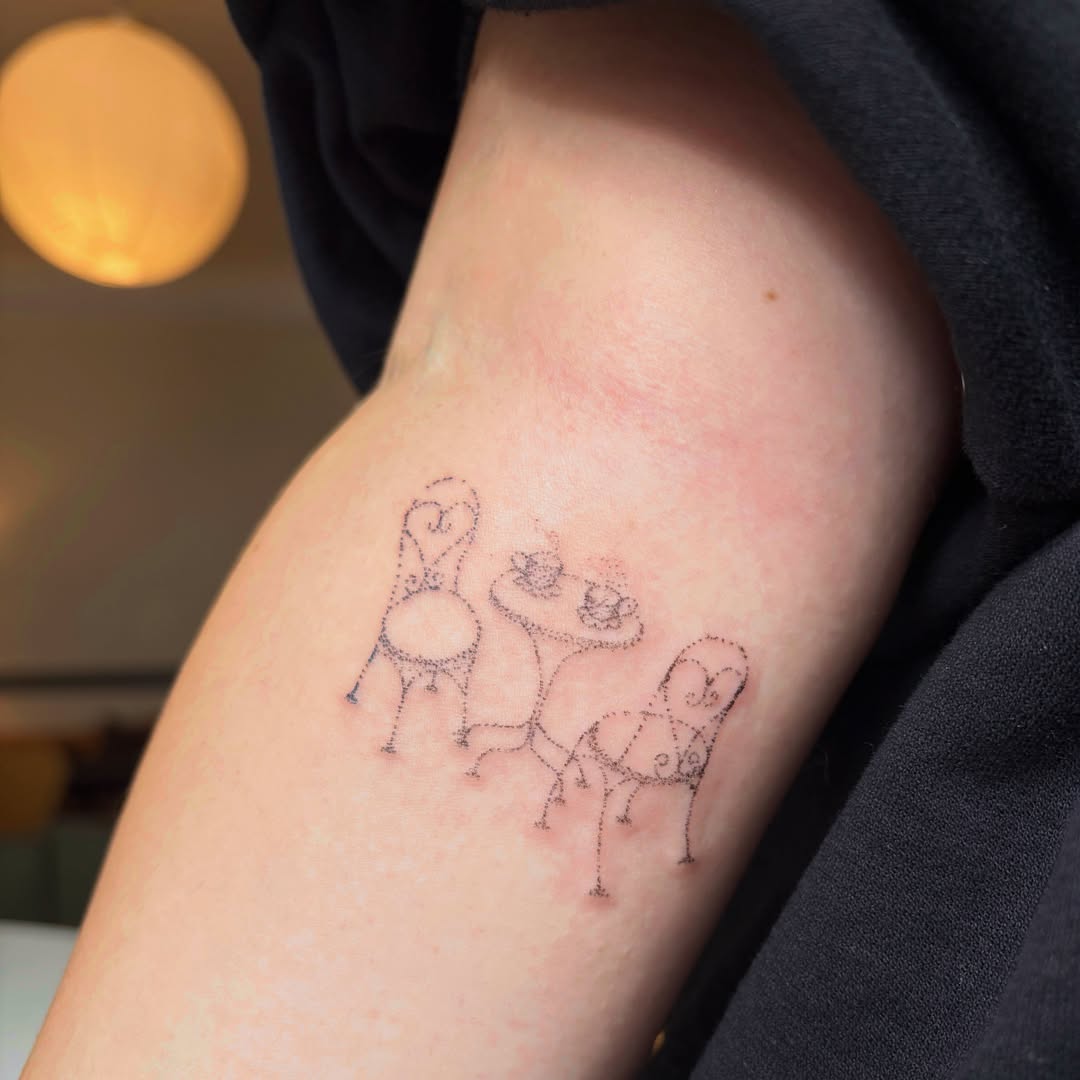 Two chairs and table dotwork tattoo on the forearm by kari