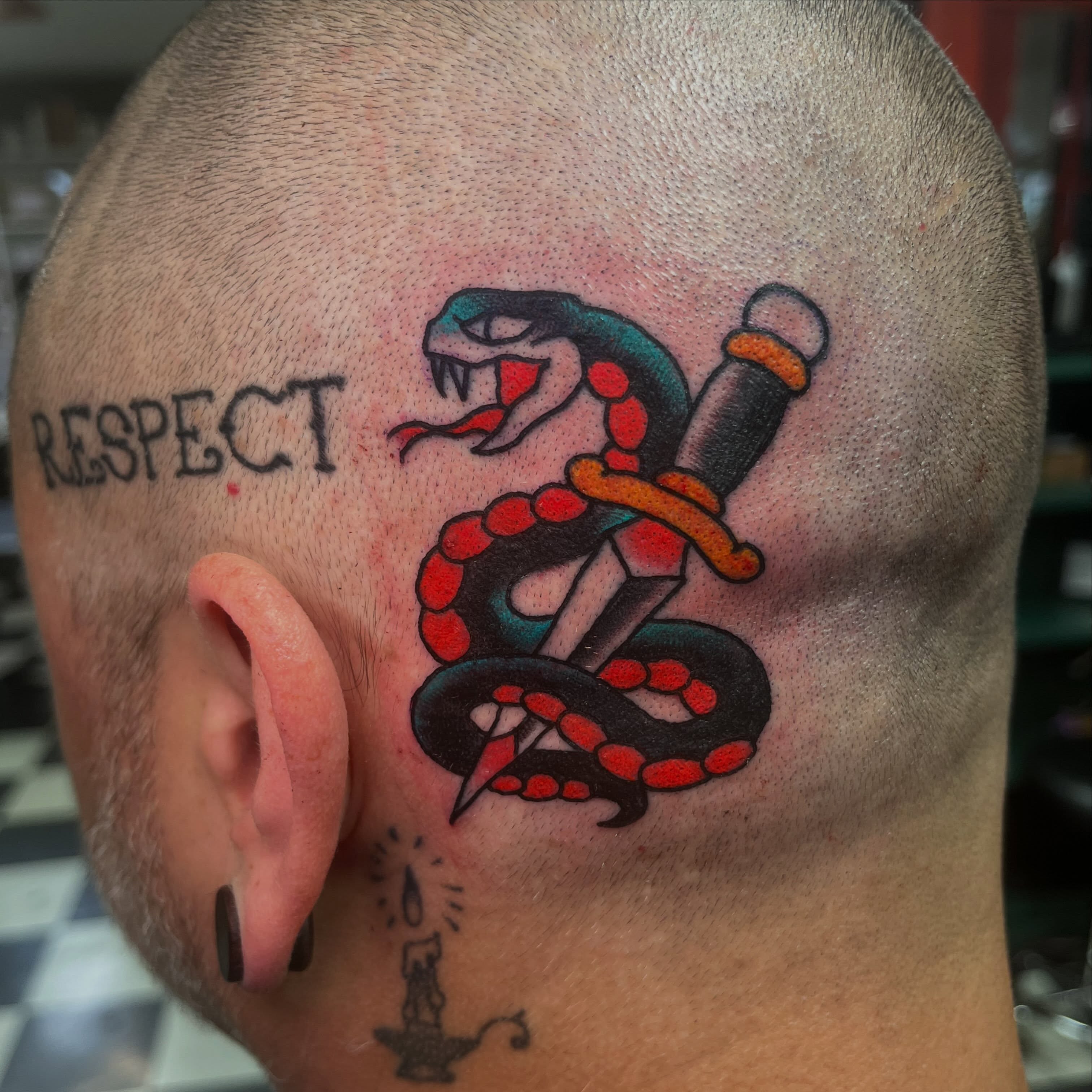 Snake and dagger American traditional tattoo on the head by Sean Swanson Tattoo Salem Oregon, Salem, Oregon