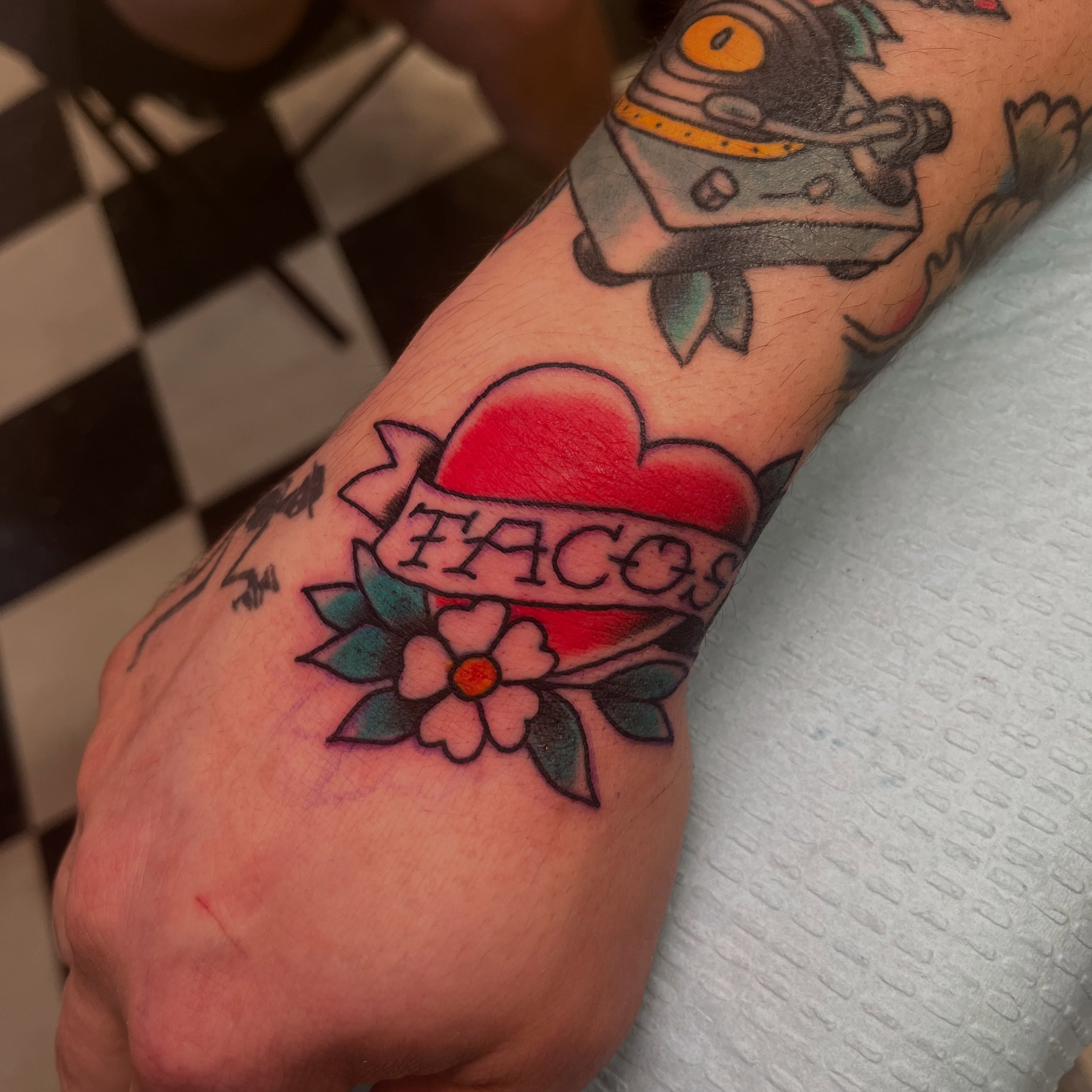 Heart with 'TACOS' banner American traditional tattoo on the forearm by Sean Swanson Tattoo Salem Oregon, Salem, Oregon