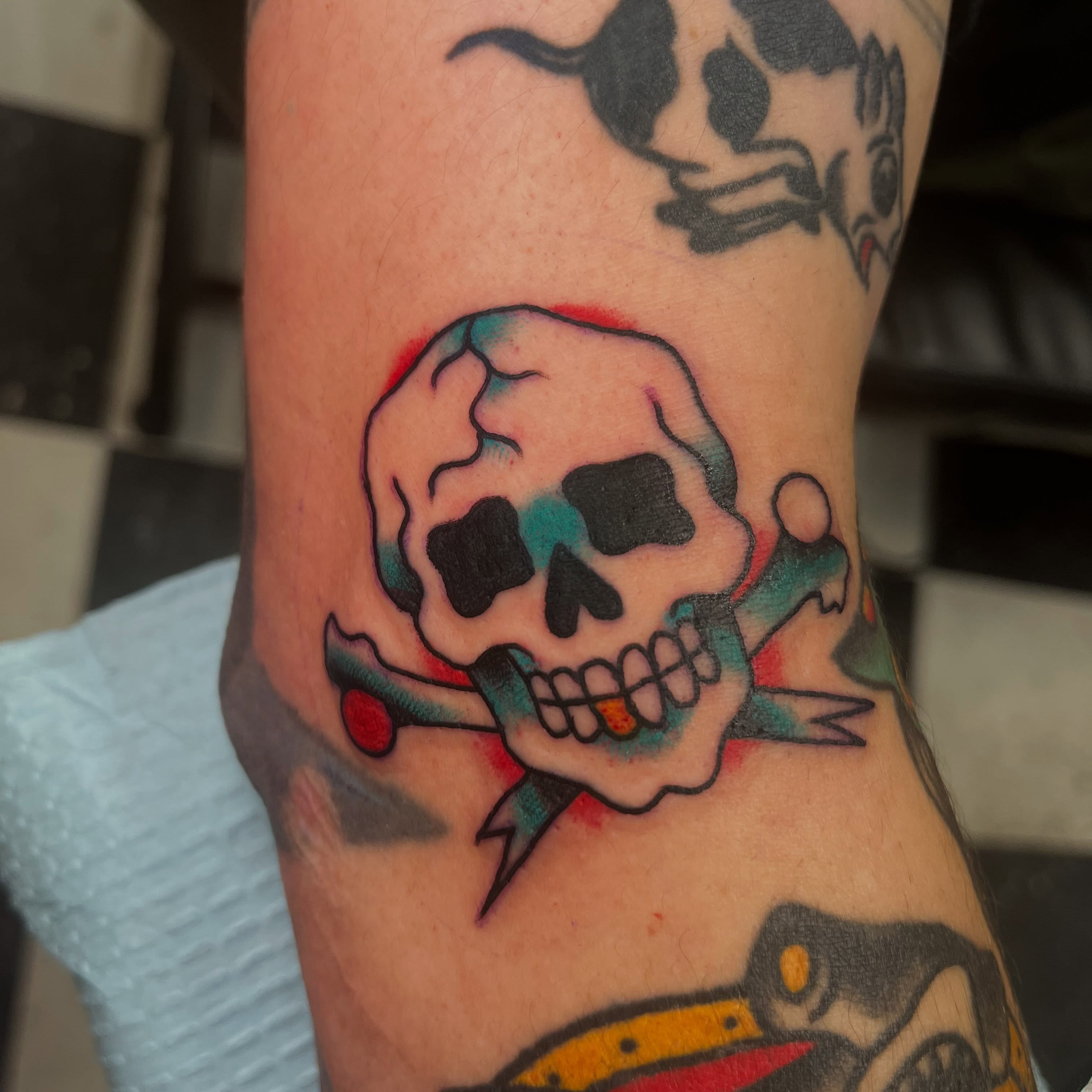 Skull and crossbones American traditional tattoo on the forearm by Sean Swanson Tattoo Salem Oregon, Salem, Oregon