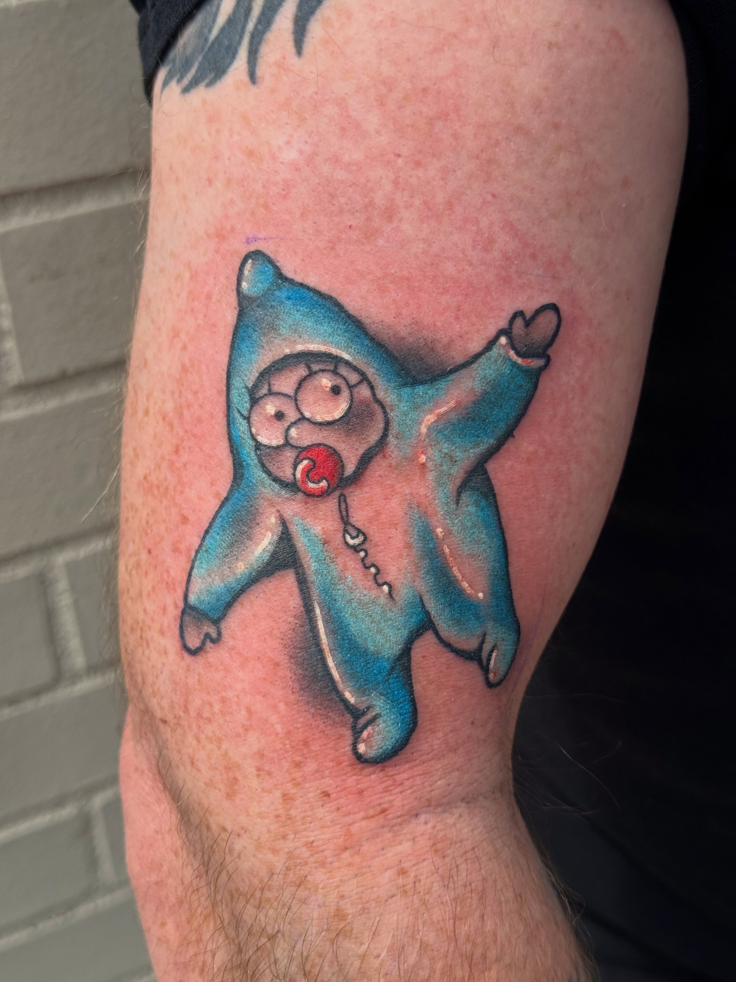 Cartoon character dotwork tattoo on the forearm by Tattoos by Angel Lee