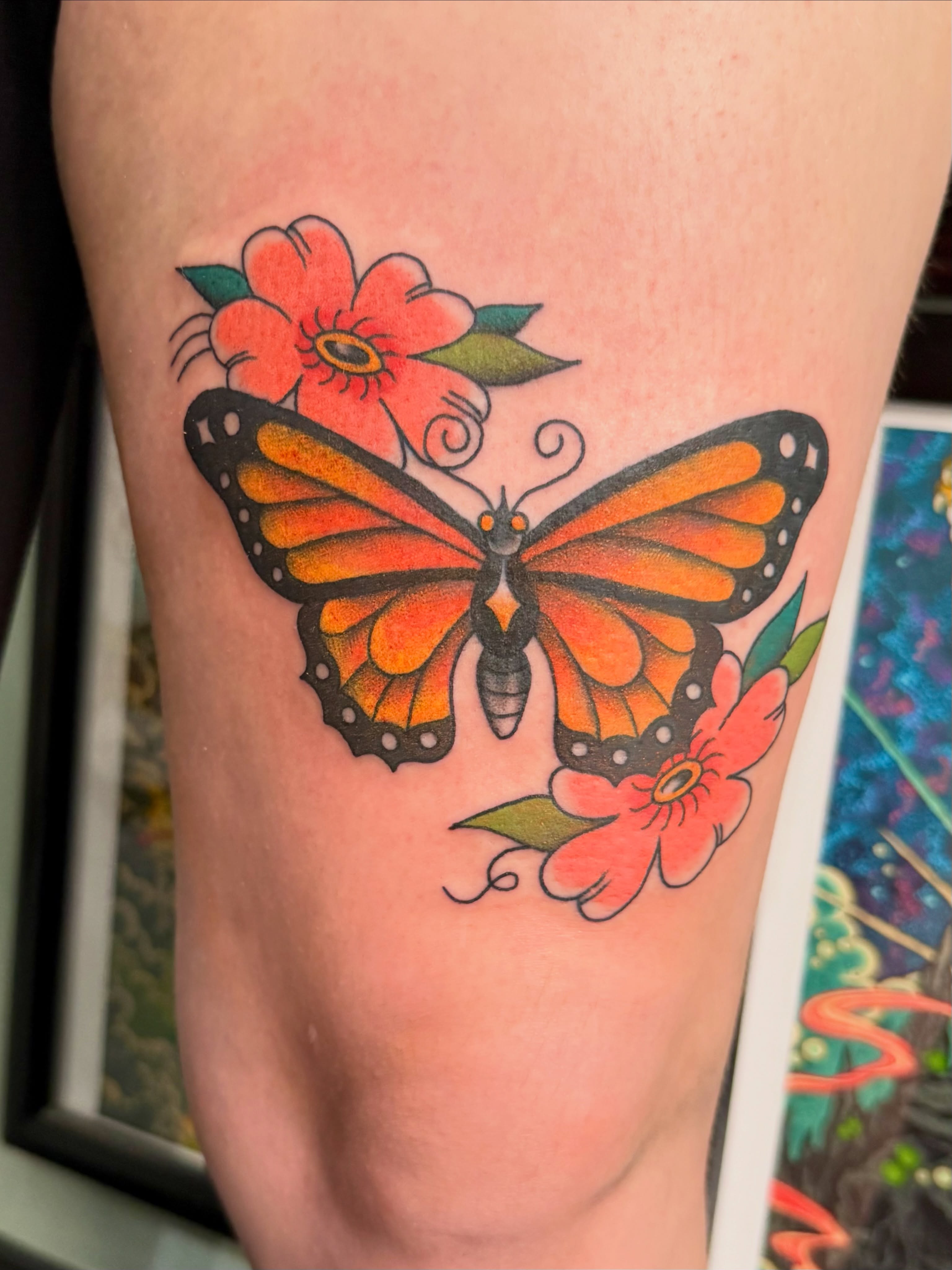 Monarch butterfly and flowers new school tattoo on the forearm by Sophie McTear