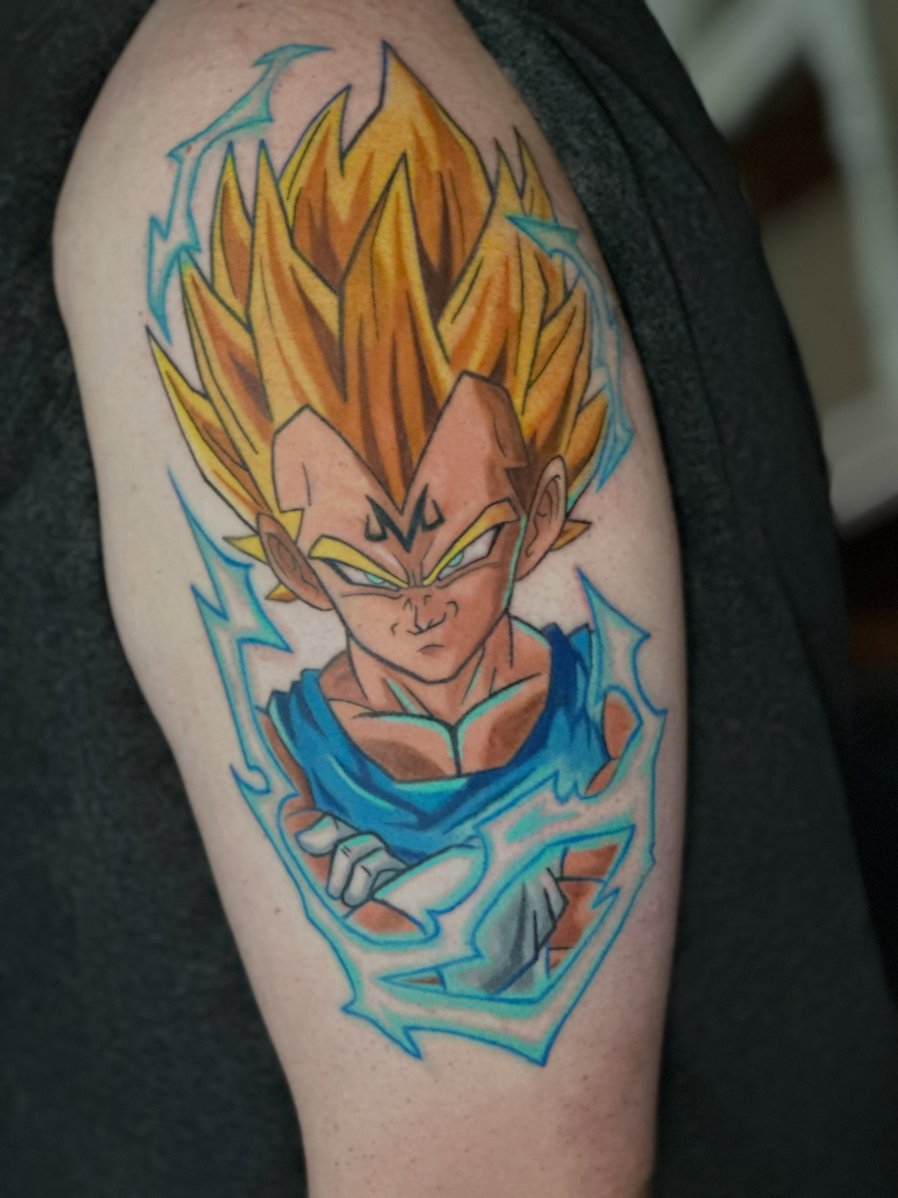 Vegeta anime tattoo on the upper arm by Dustin Hughes