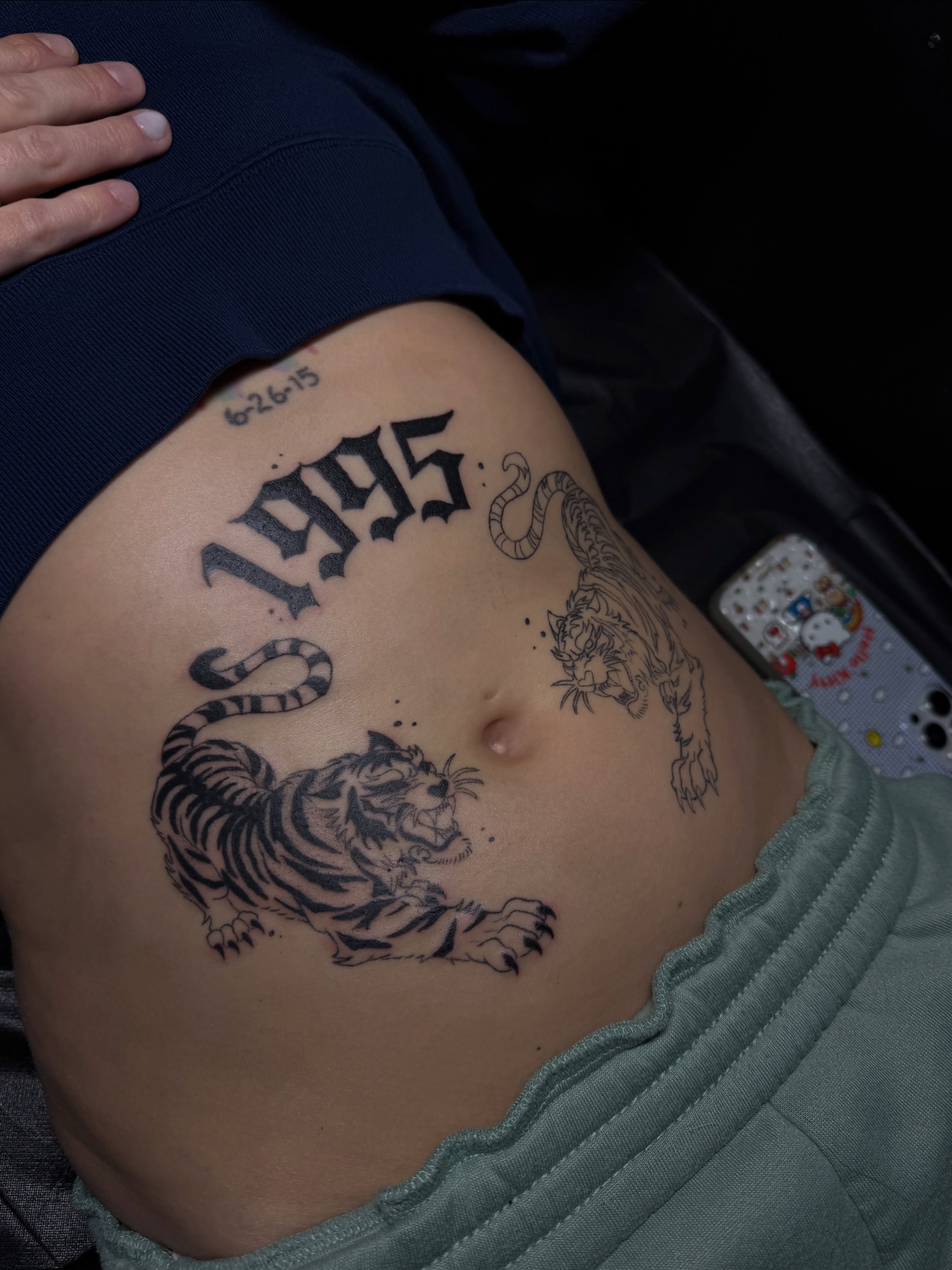 Tiger and year black and grey tattoo on the torso by Yassin alsaje