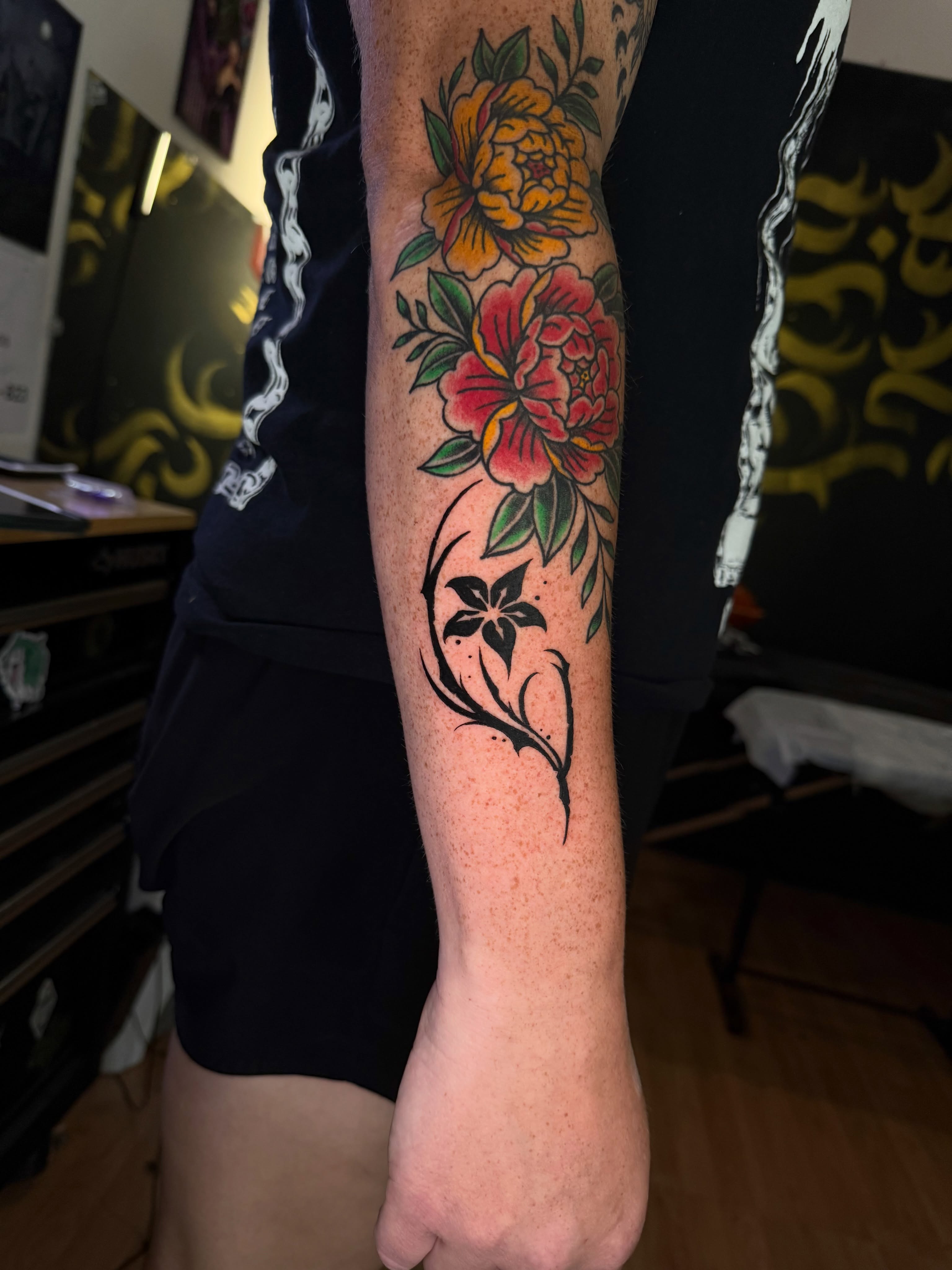 Floral arrangement American traditional tattoo on the forearm by Yassin alsaje