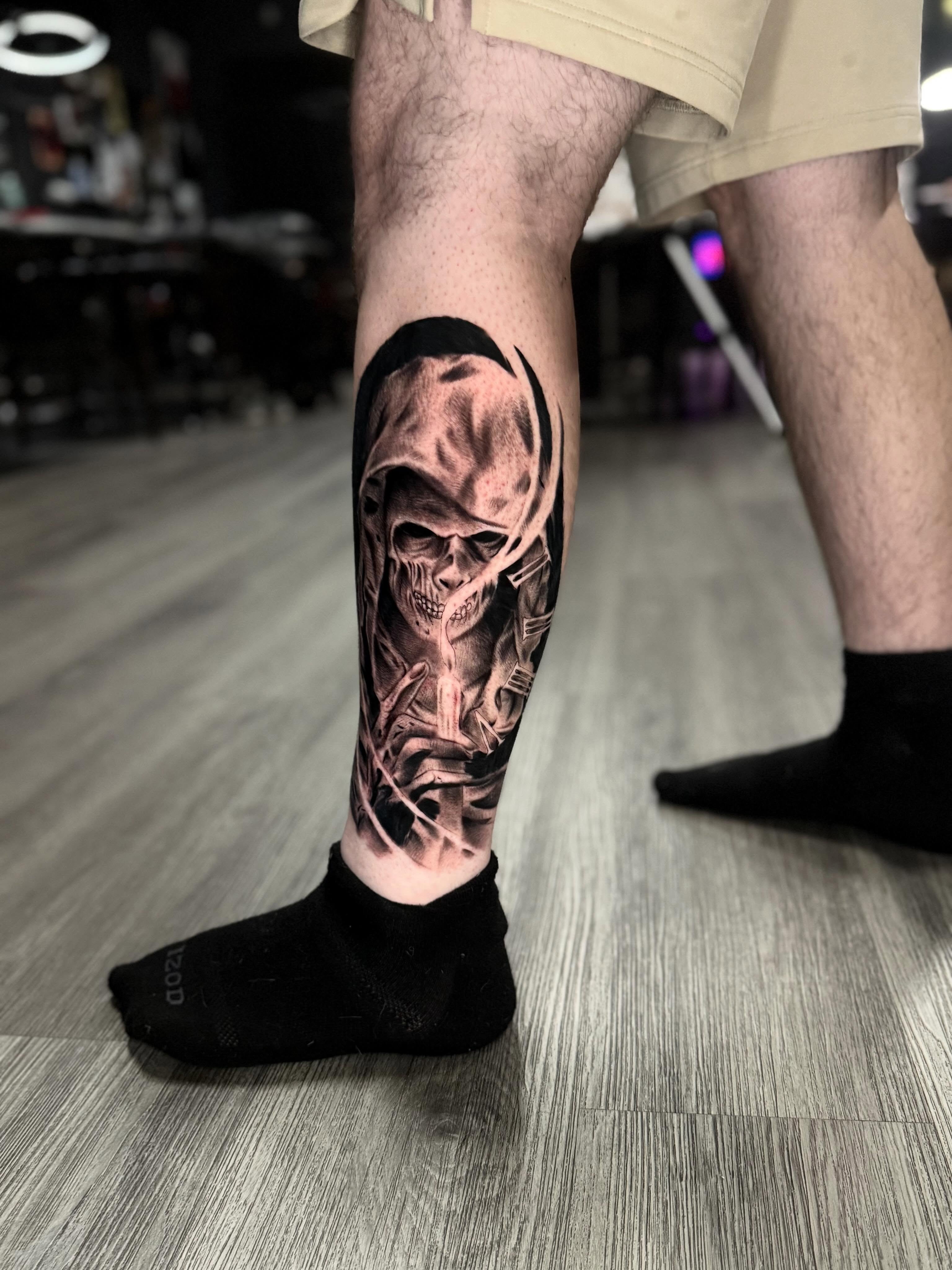 Grim reaper dark realism tattoo on the calf by Adrián Banuelos
