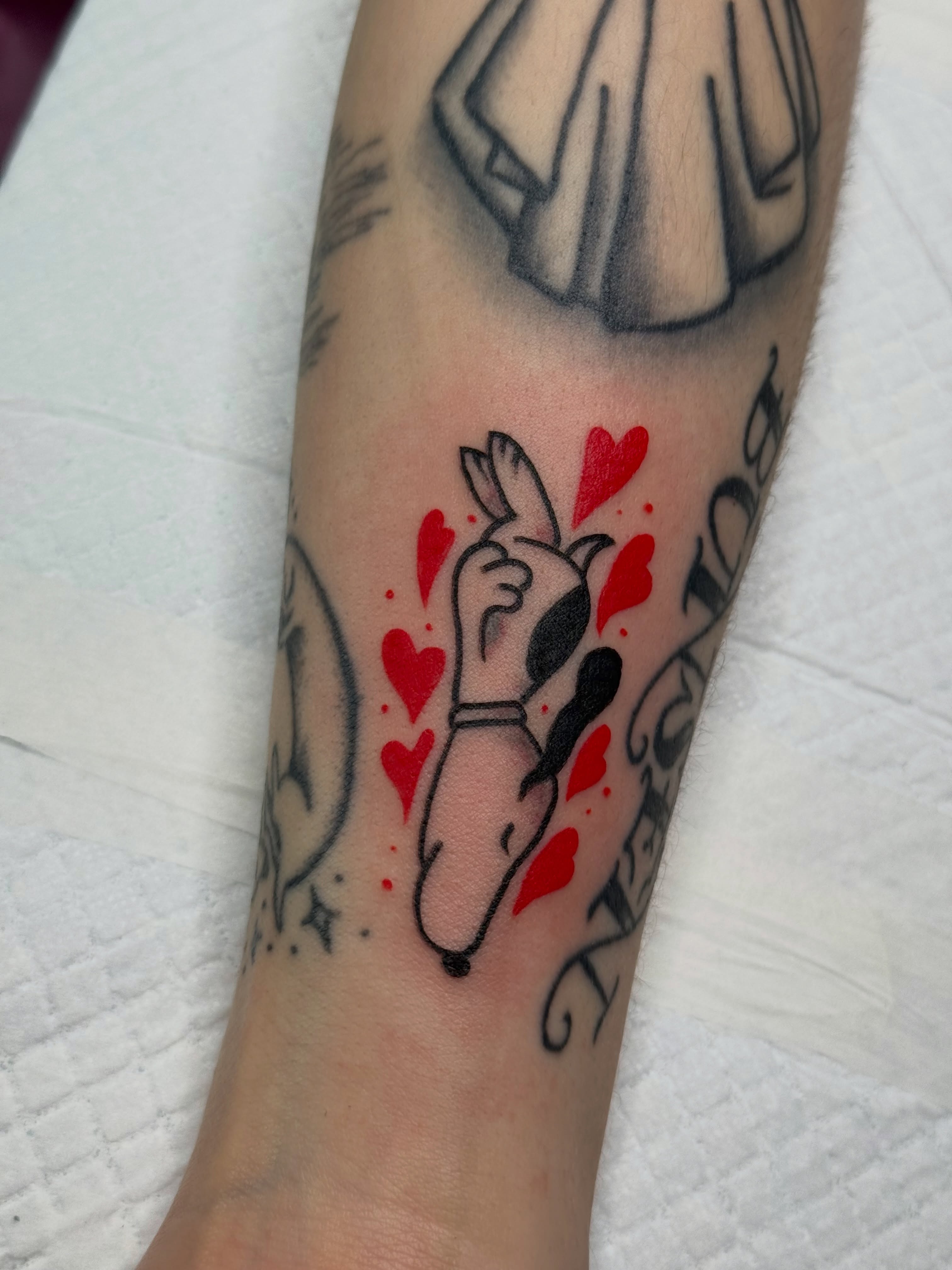Hand with hearts dotwork tattoo on the forearm by Chelsea Graham, Seattle, Washington