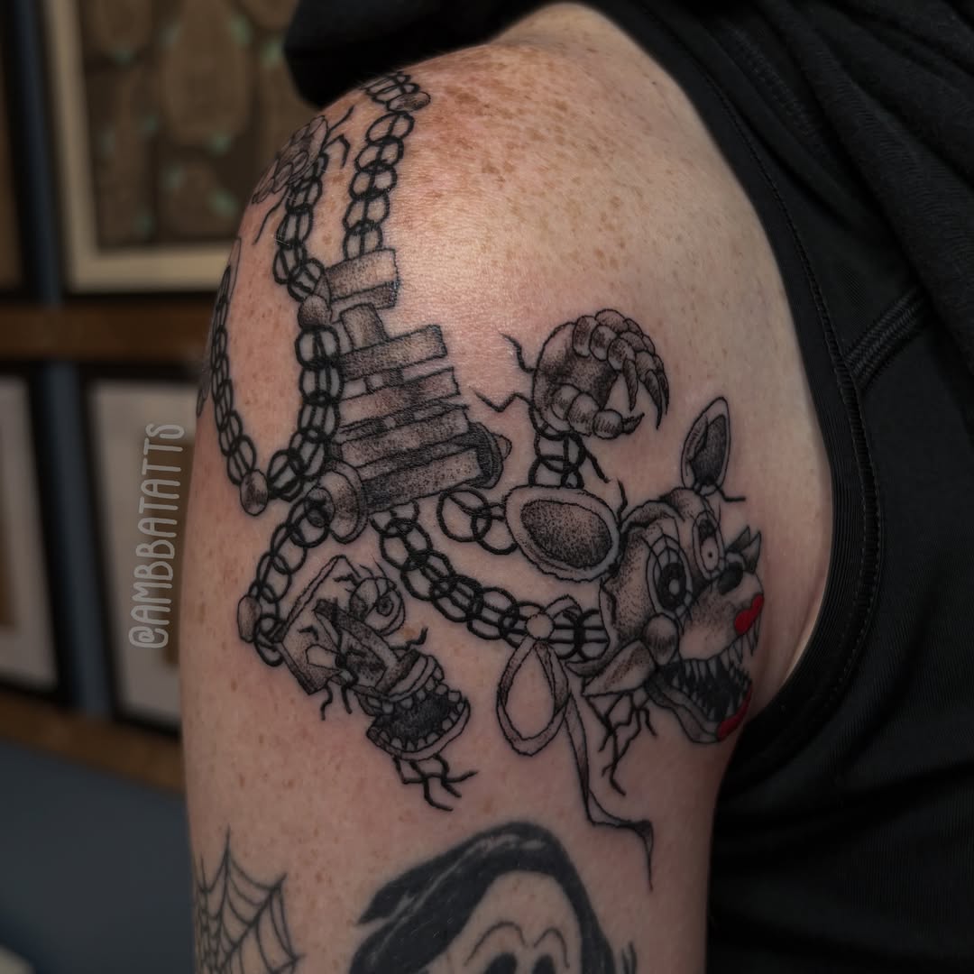 Funko pop characters black and grey tattoo on the shoulder by amber brady, Brunswick, Ohio