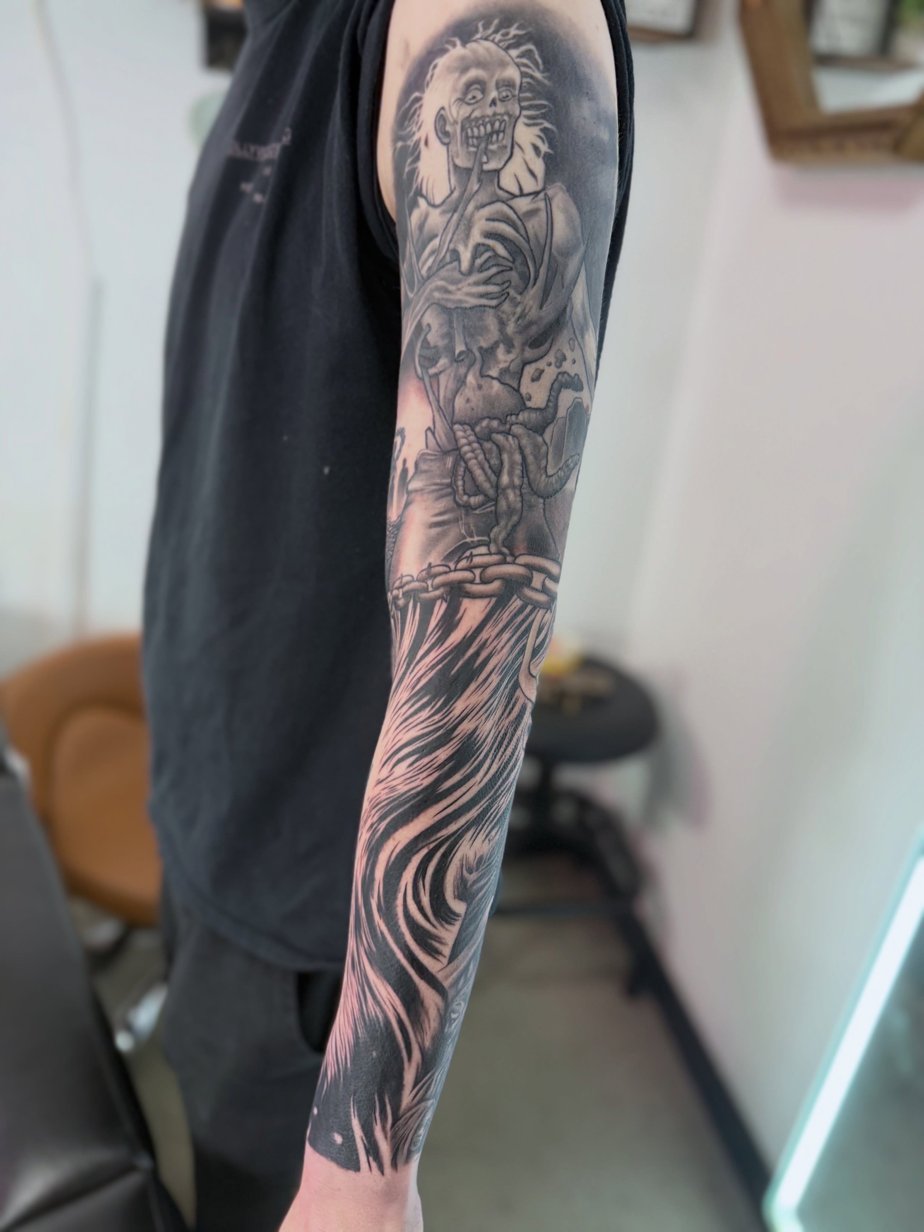 Skeleton with chains black and grey tattoo on the forearm by Toni🌊
