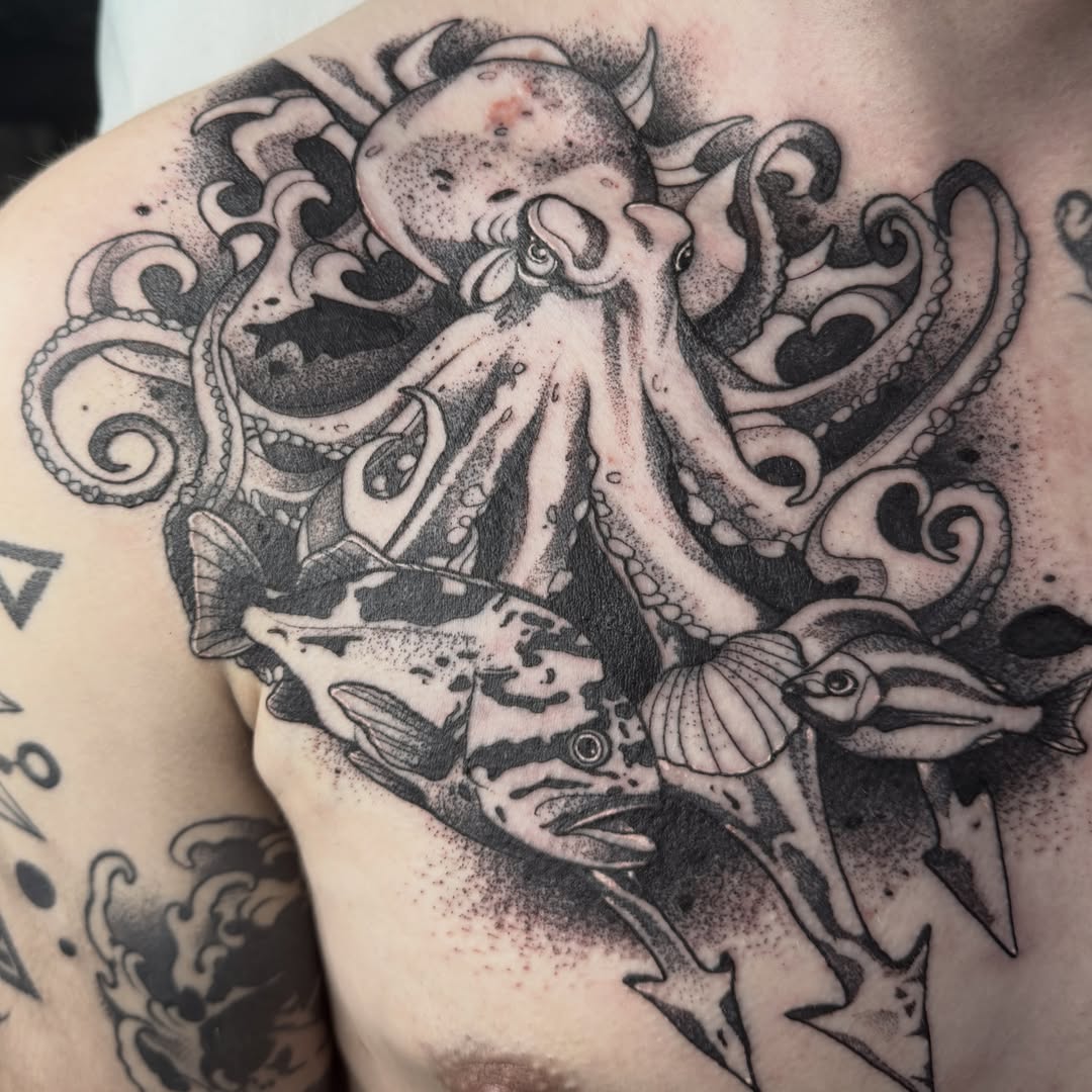 Octopus and fish dotwork tattoo on the chest by Aiden Shaw