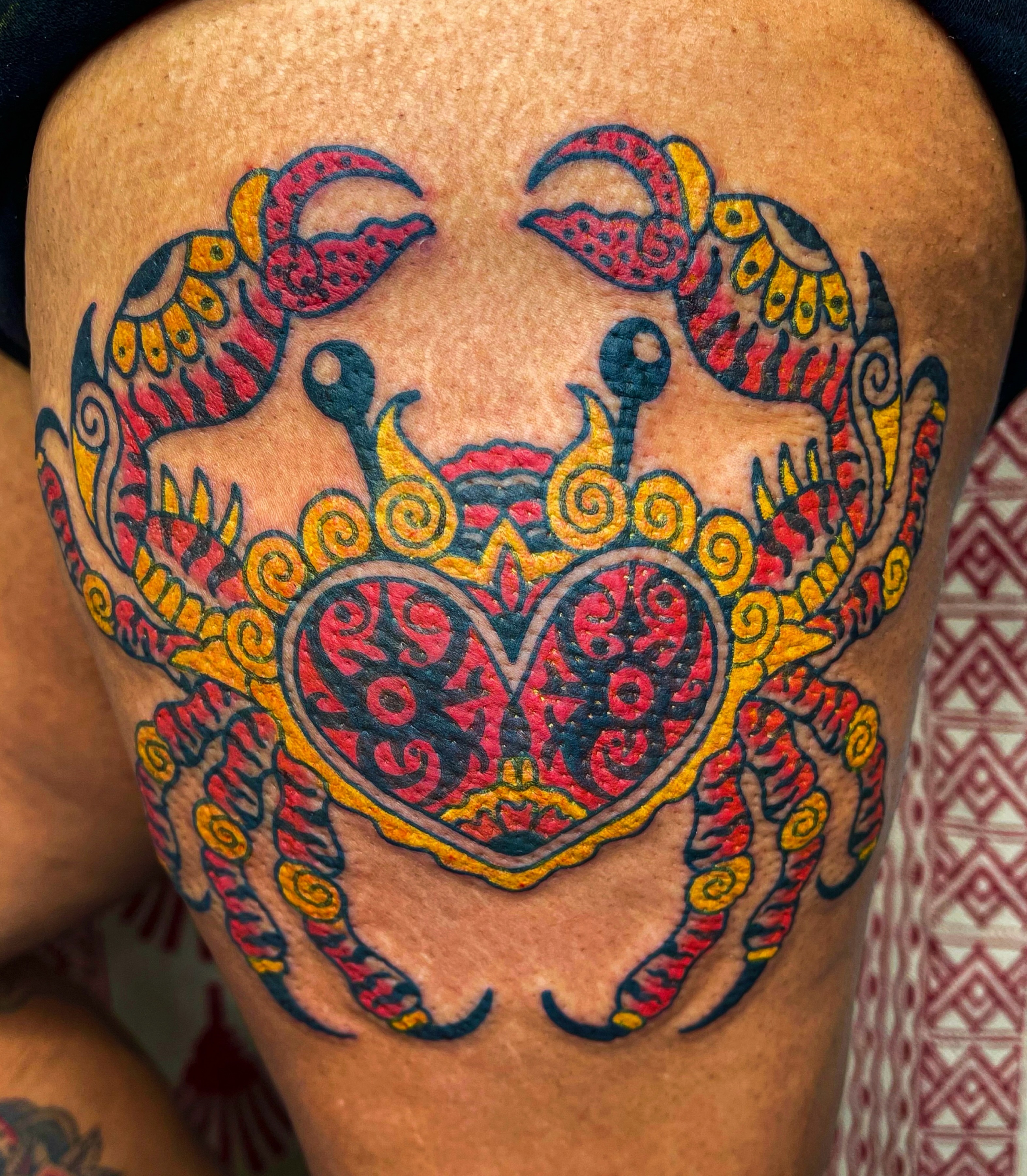 Crab ornamental tattoo on the thigh by Swasthik Iyengar, New York, New York