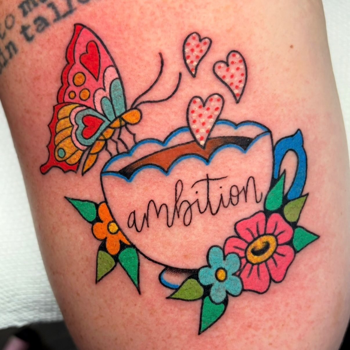 Ambition American traditional tattoo on the thigh by Alena McDonald