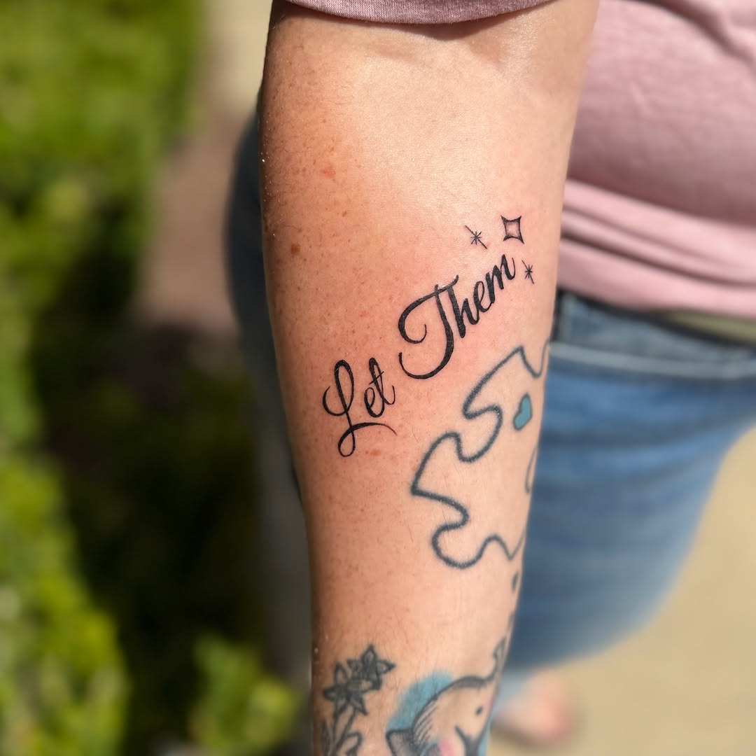 Let Them lettering script tattoo on the forearm by K. Bel Art