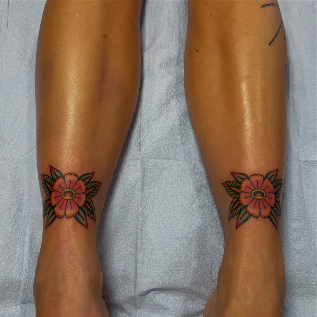 Flower American traditional tattoo on the calf by Kaley, Des Moines, Iowa