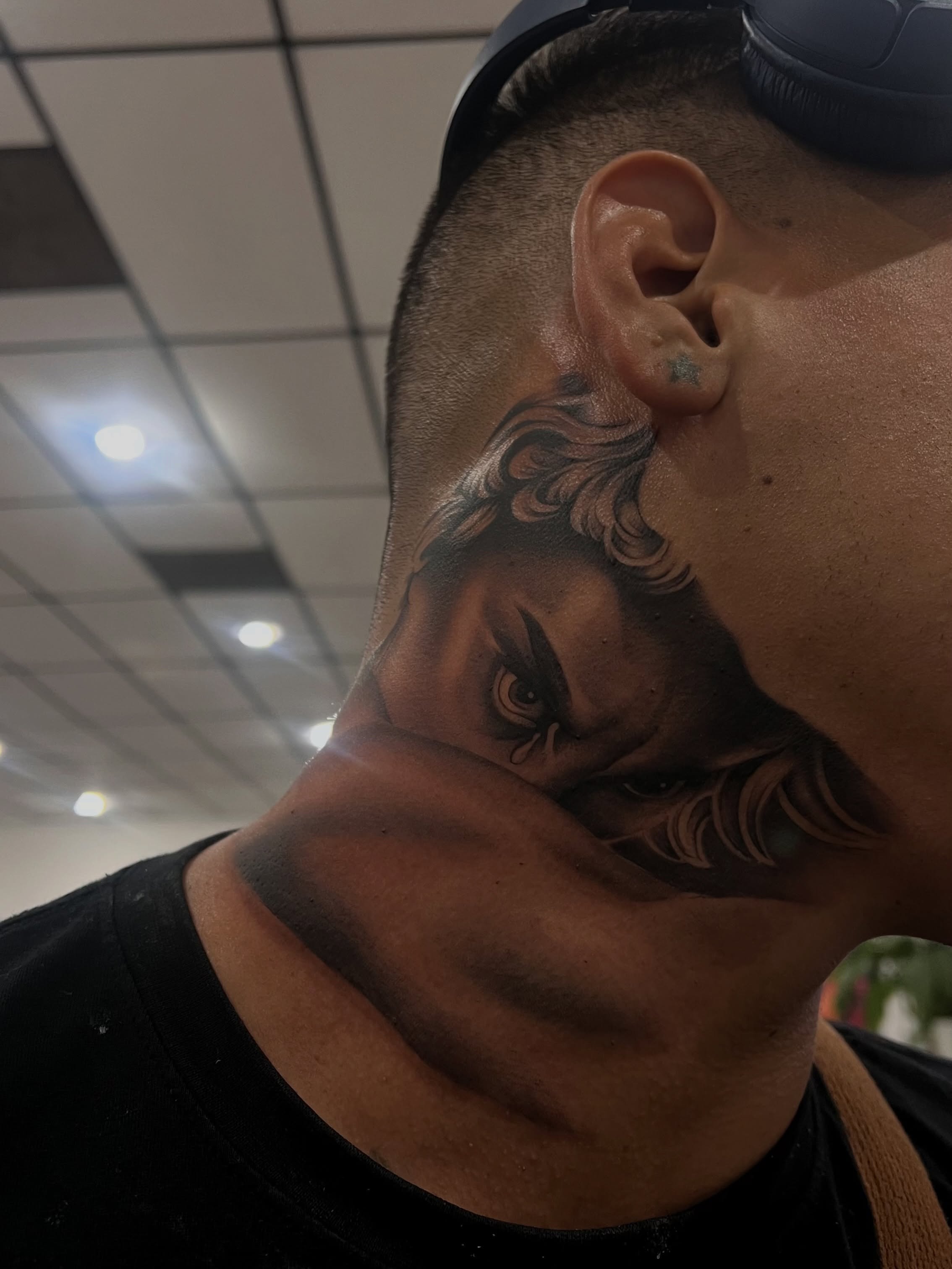 Woman's face realism tattoo on the neck by Espi