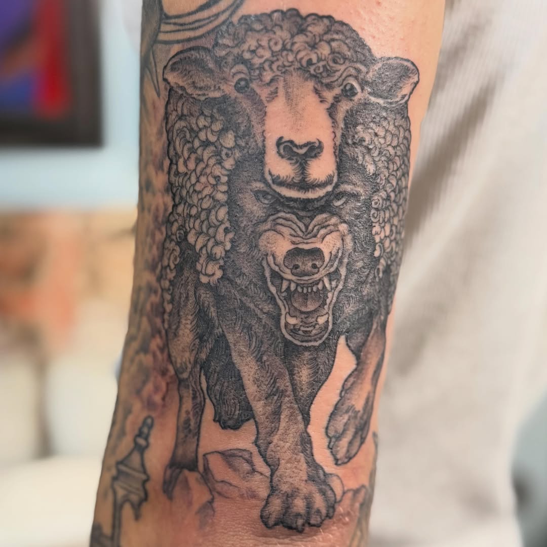 Sheep black and grey tattoo on the forearm by Tony Beuke