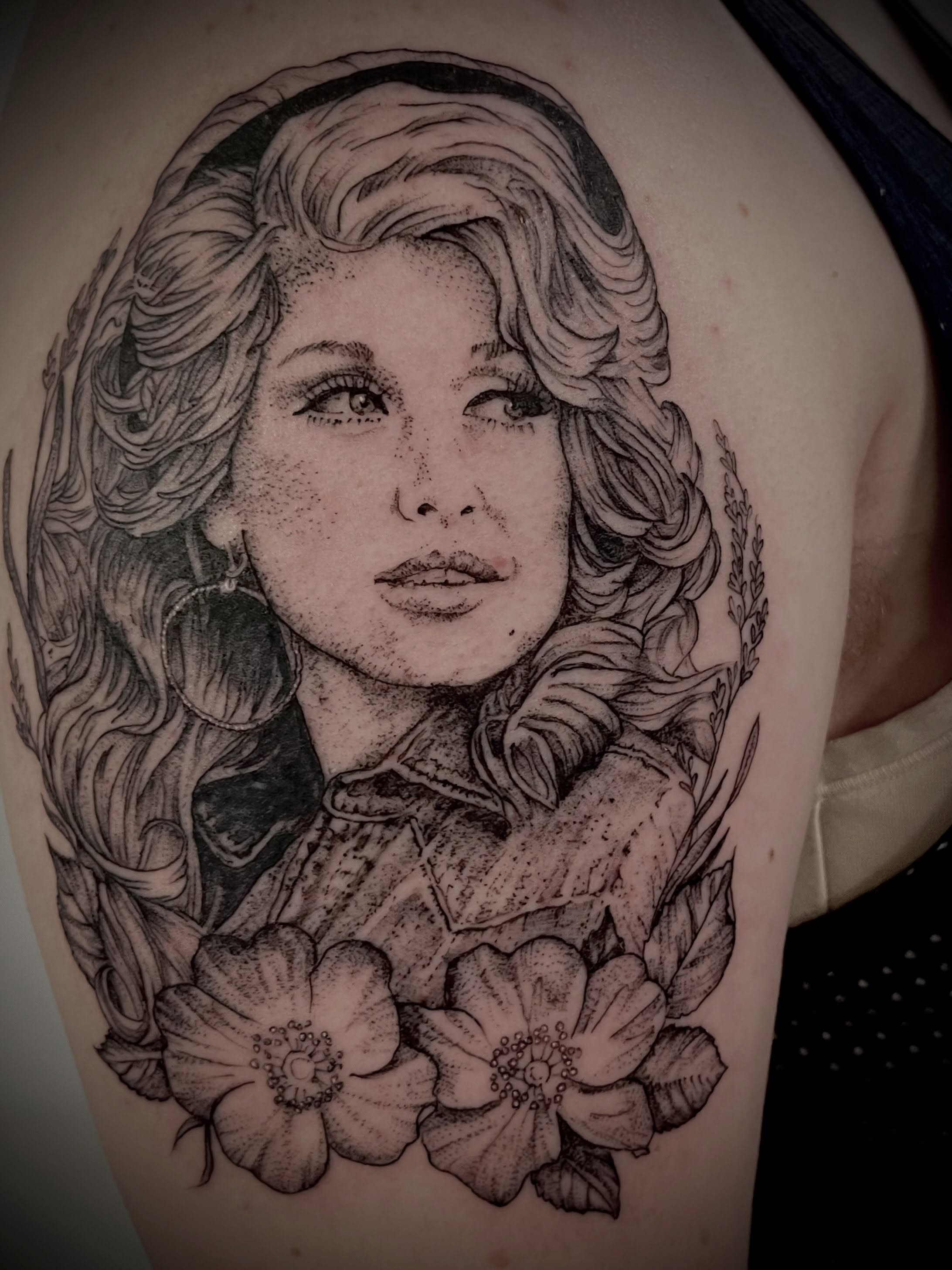Portrait of a woman dotwork tattoo on the shoulder by Christen Wolfe CA Tattooer