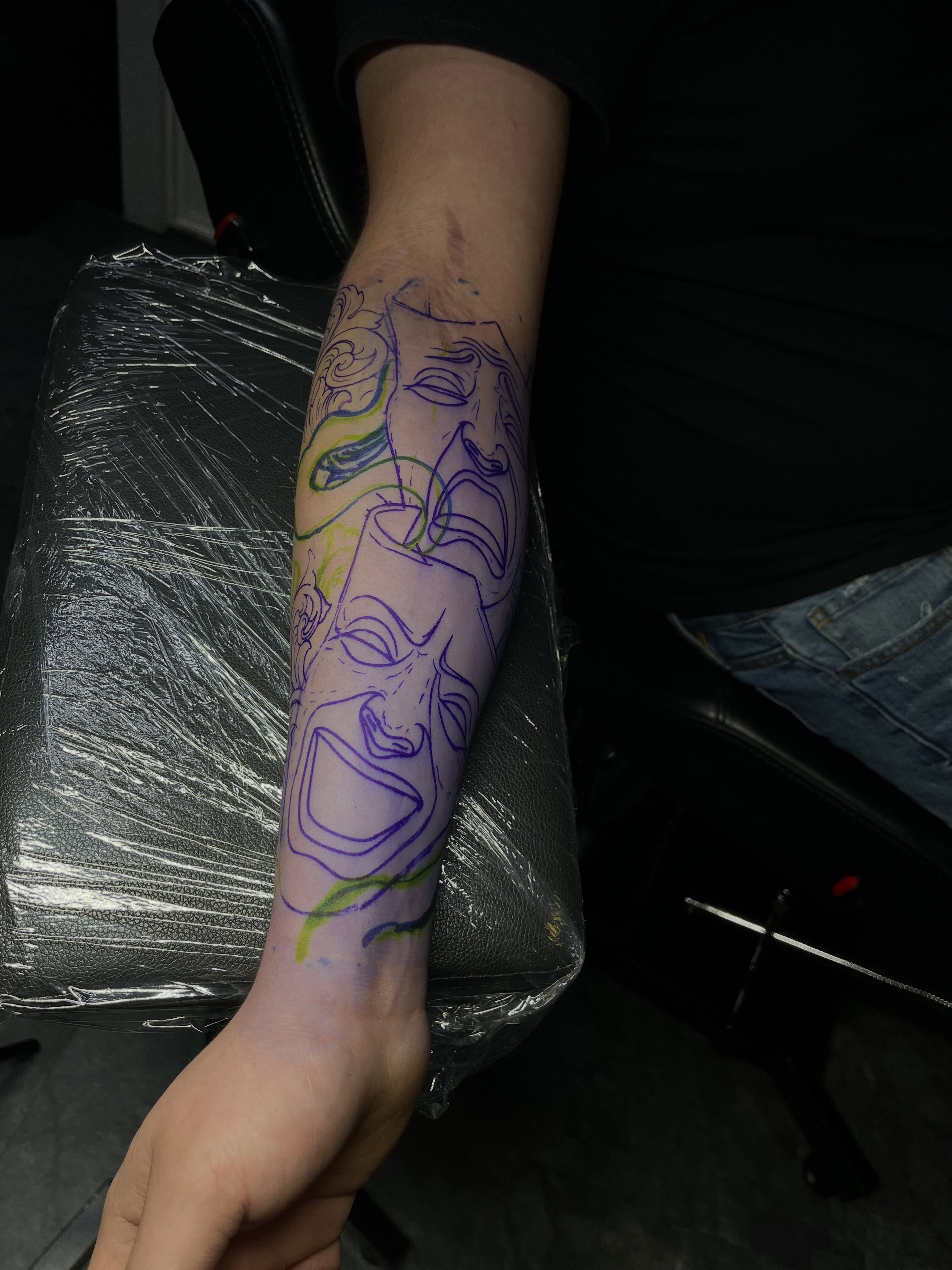 Mask fine line tattoo on the forearm by DFW