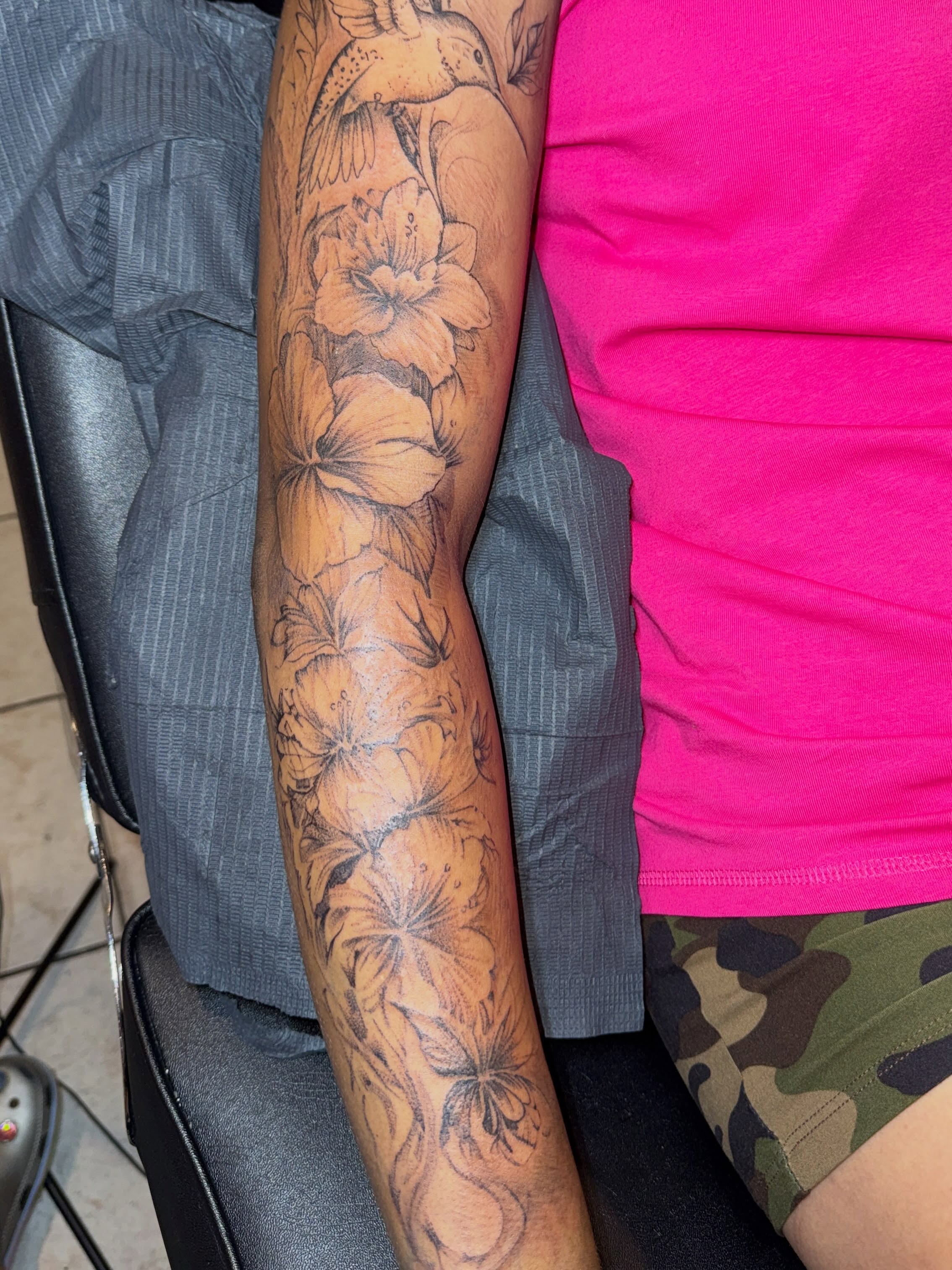 Lilies black and grey tattoo on the forearm by Destini