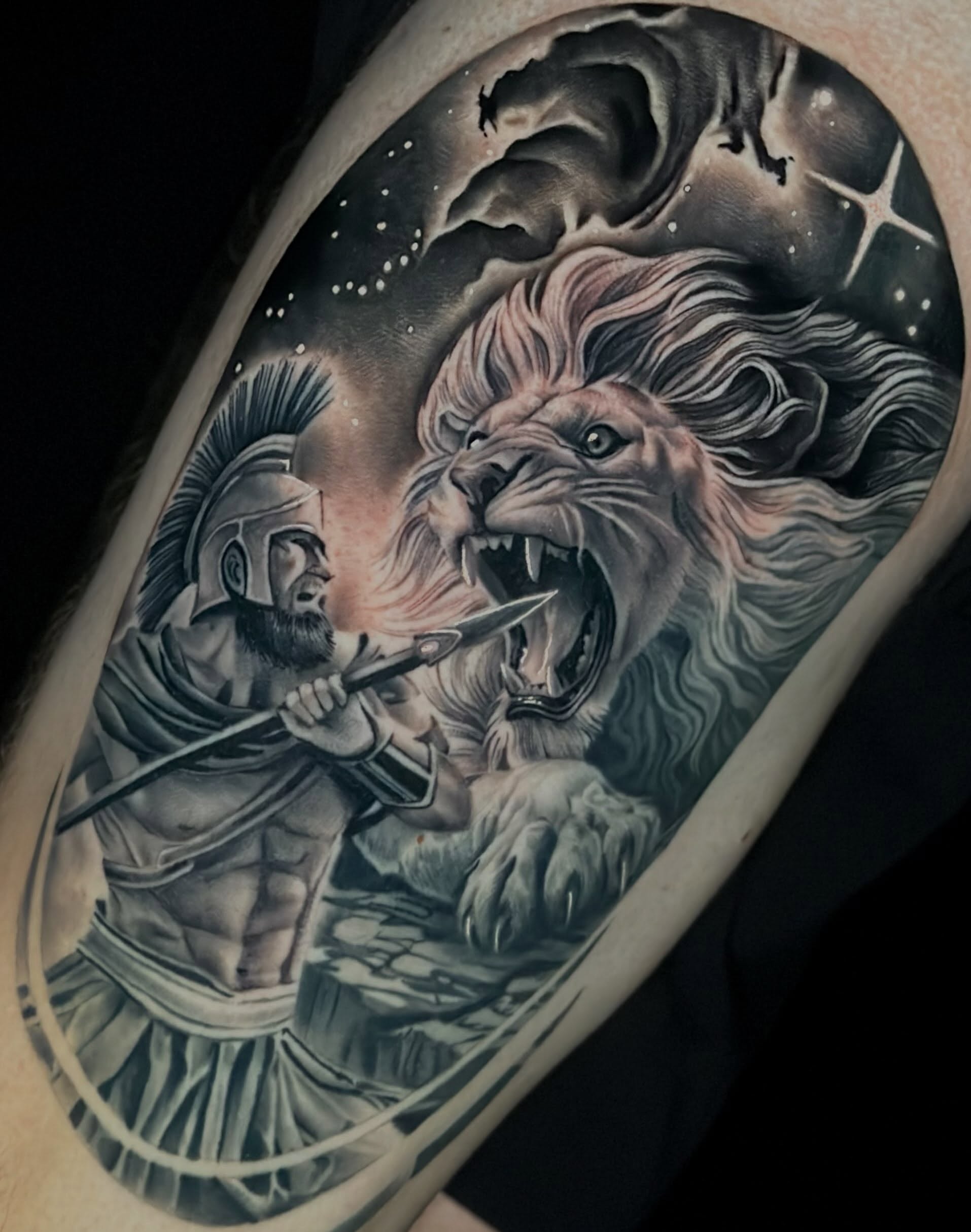 Lion and warrior realism tattoo on the forearm by Katie Kelley