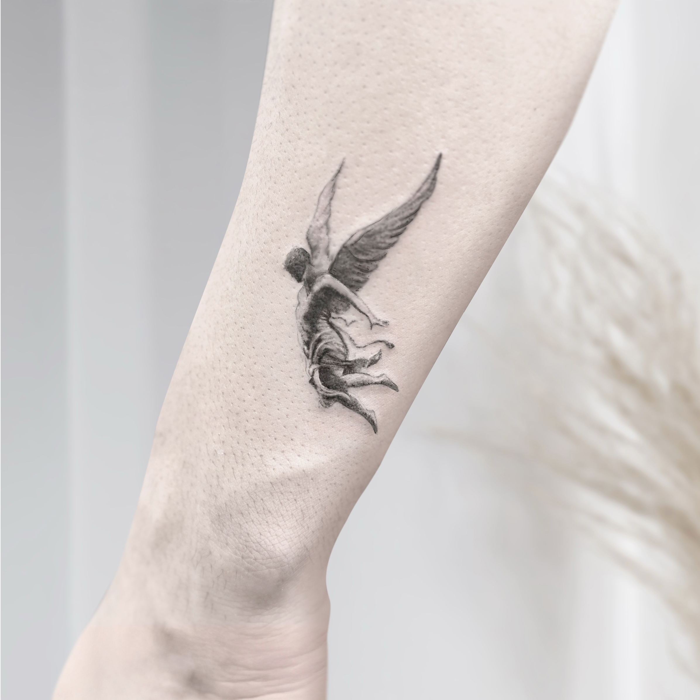 Angel black and grey tattoo on the forearm by R o s e