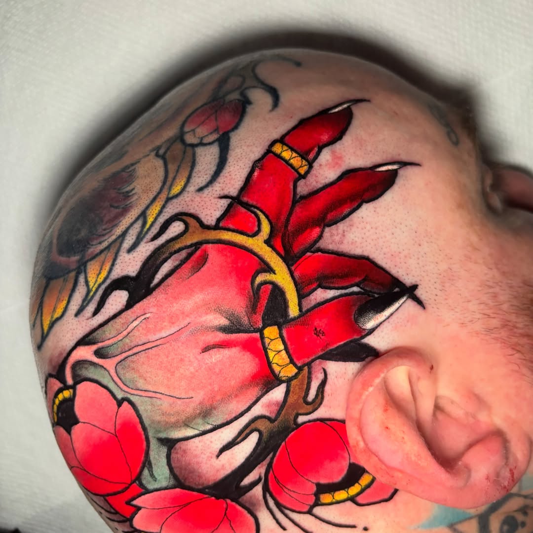 Heart with dagger American traditional tattoo on the shoulder by Matt Stolzenburg