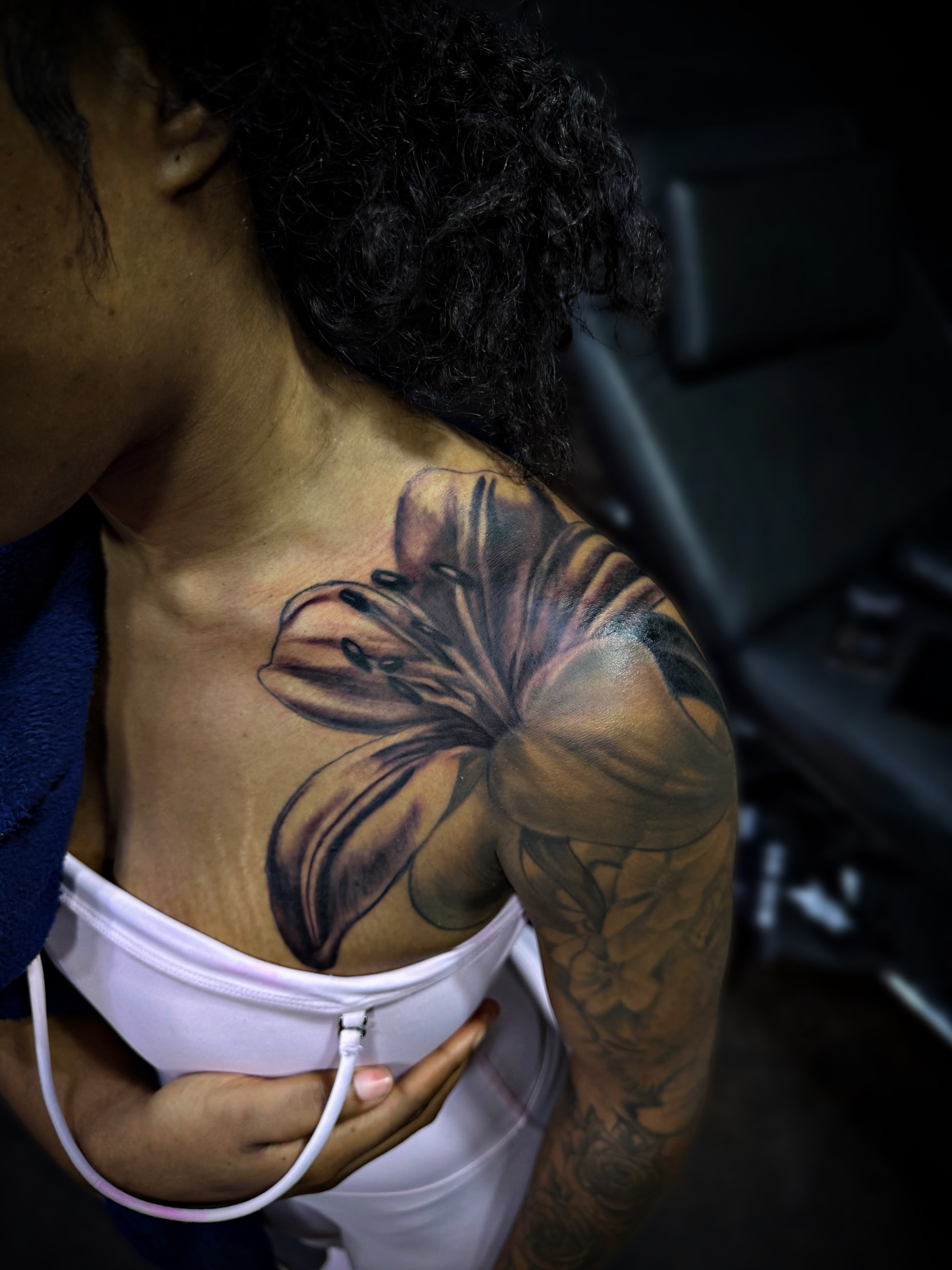 Lily realism tattoo on the shoulder by Dallas Tattoo Artist📍