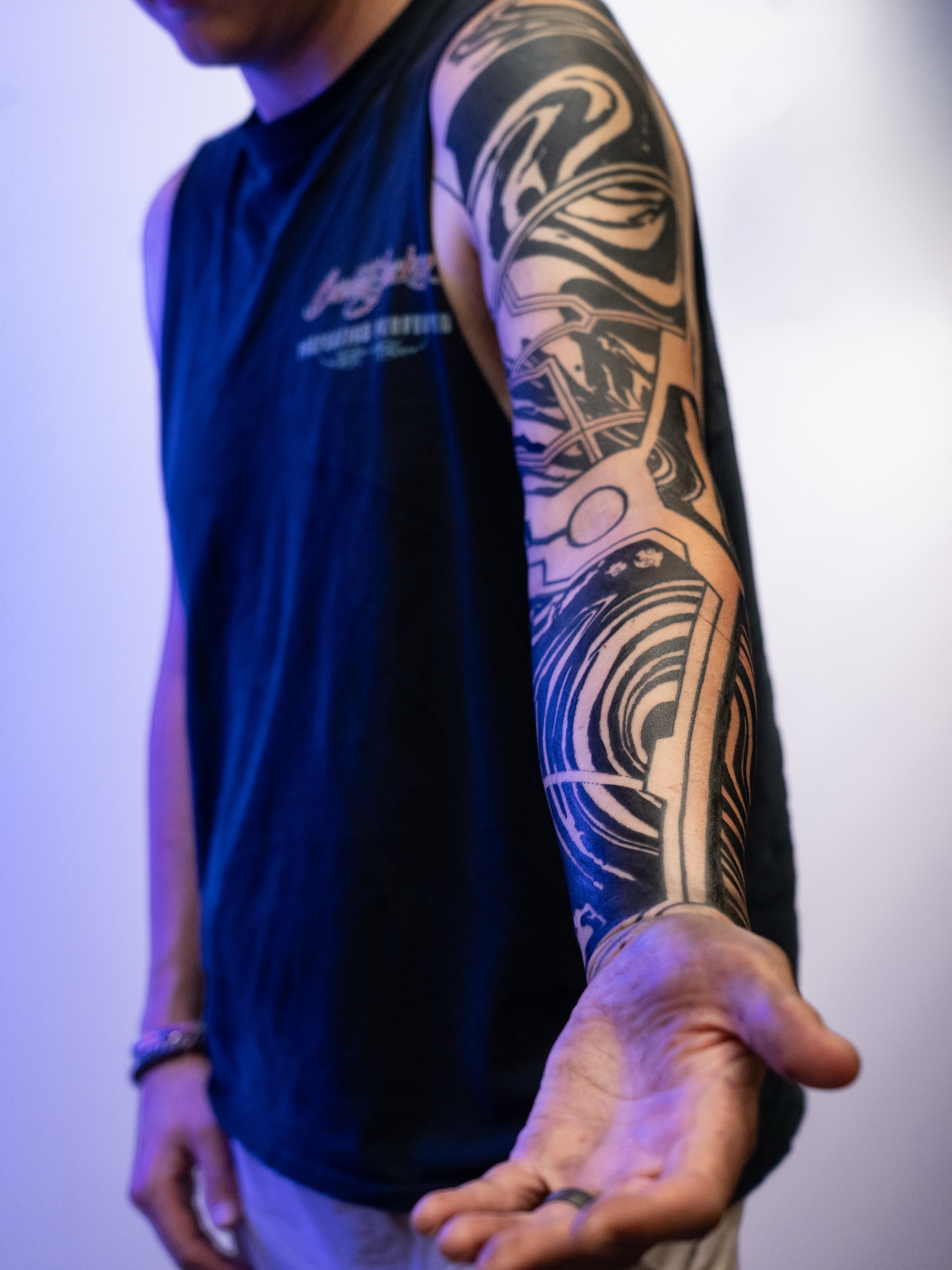 Mechanical engine black and grey tattoo on the upper arm by Josaline Green