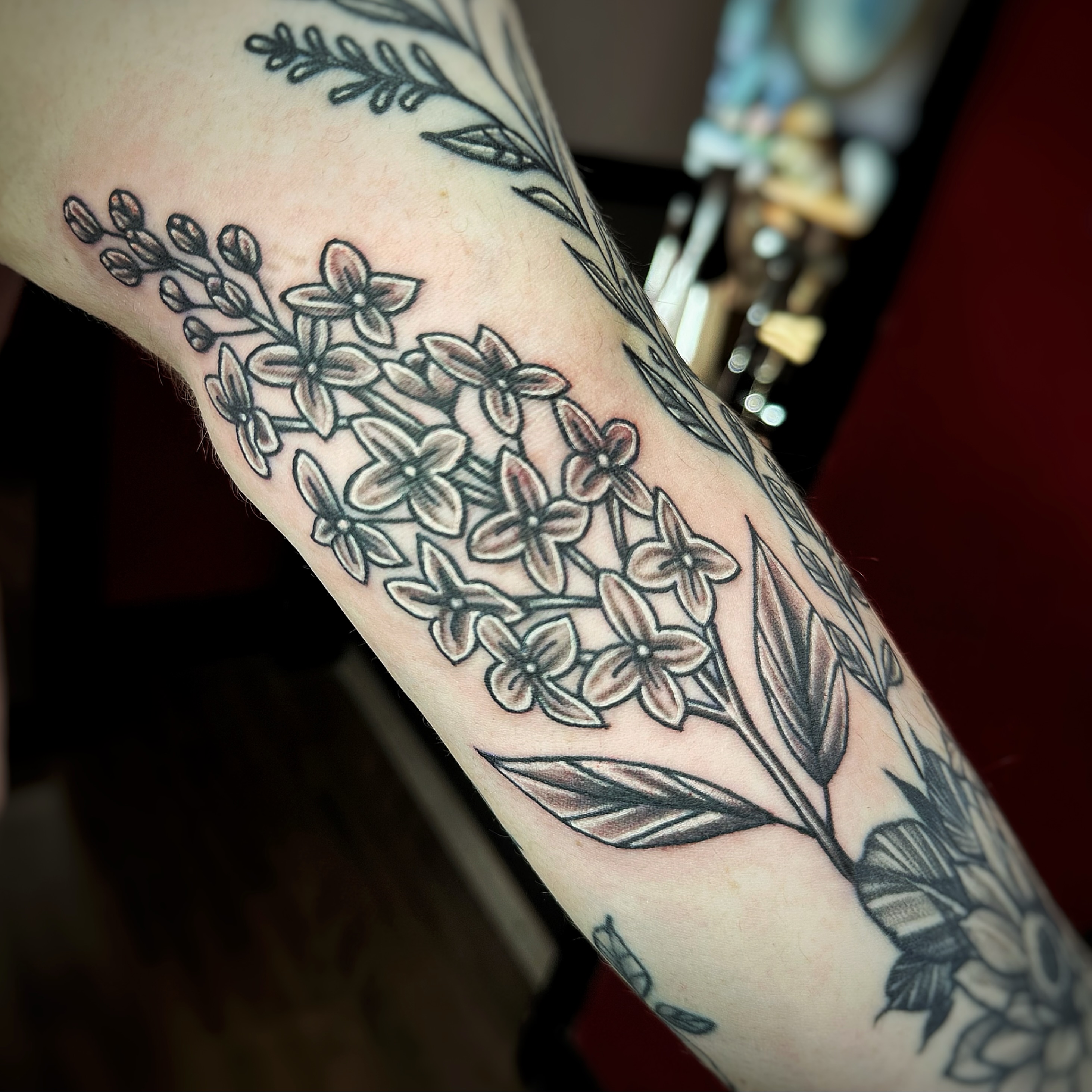 Flower bouquet black and grey tattoo on the forearm by Anthony Guido