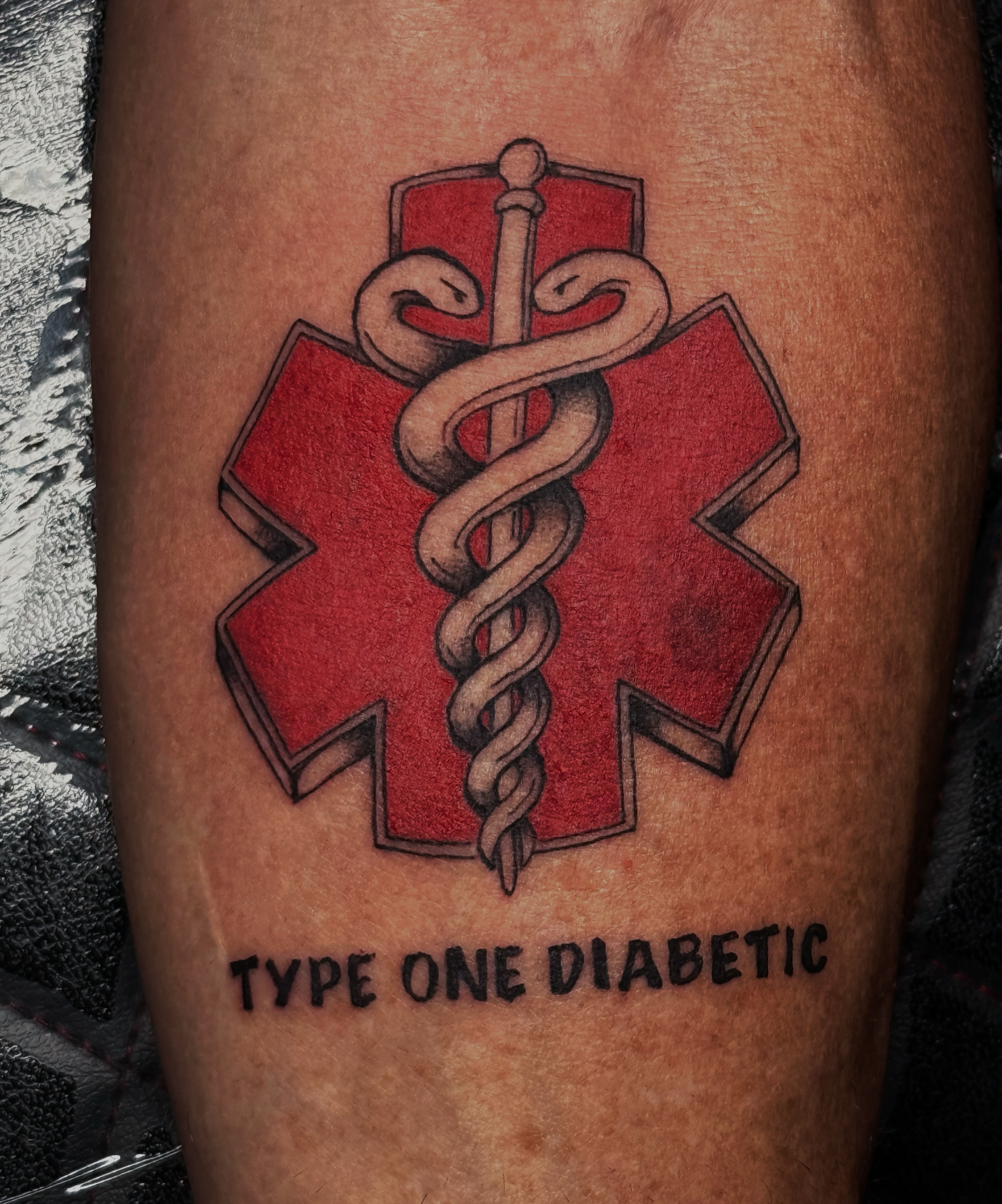 Medical symbol realism tattoo on the forearm by Kaylee Castleton, Tooele, Utah