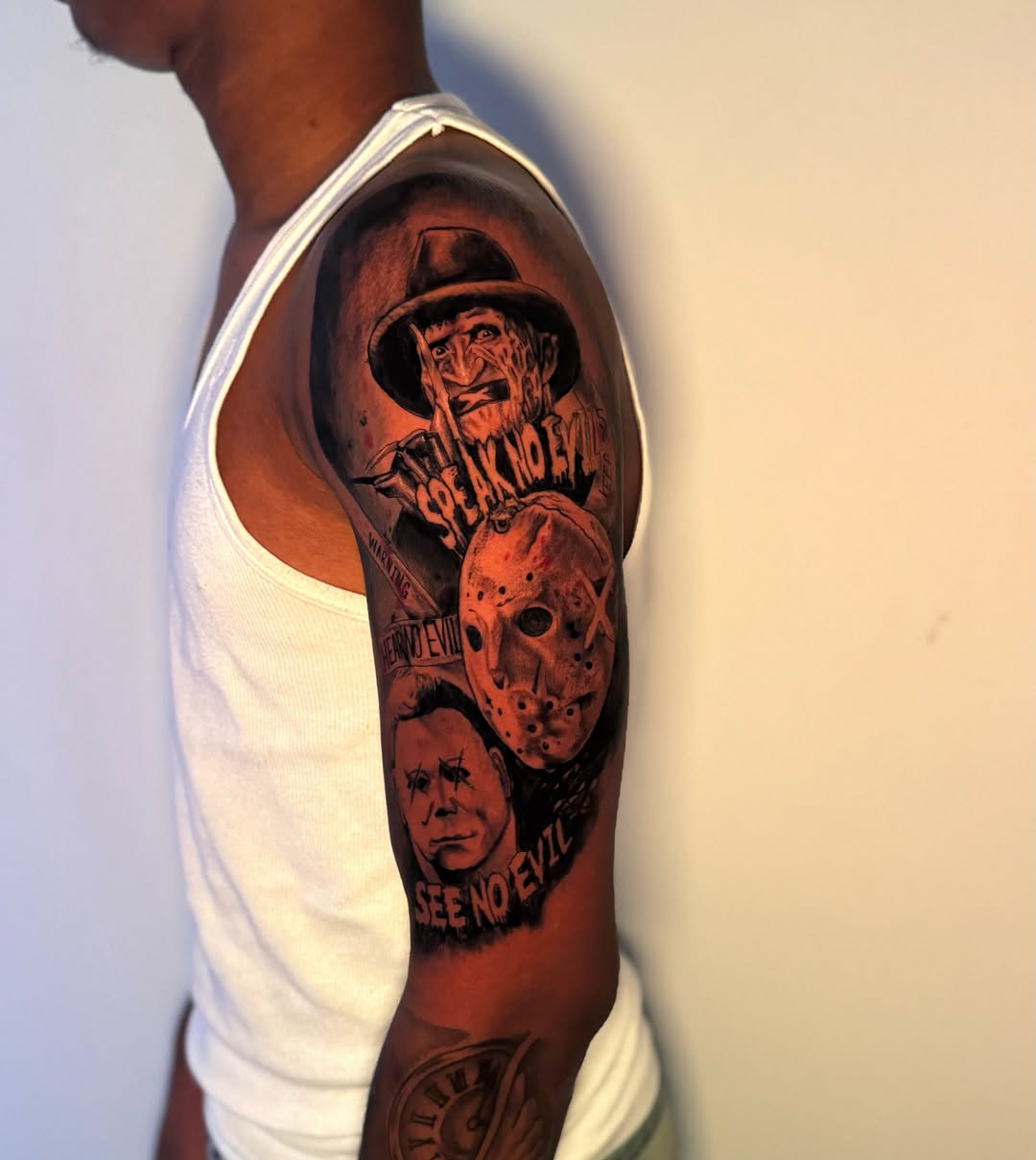 Horror movie characters realism tattoo on the upper arm by Asia Rene Tattoos👑