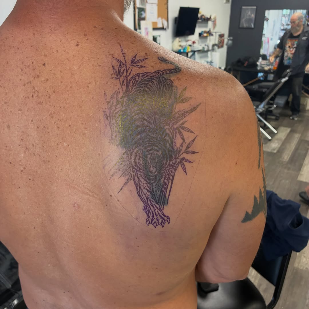 Bird and bamboo black and grey tattoo on the shoulder by Hit & Run Tattoo, Dayton, Ohio