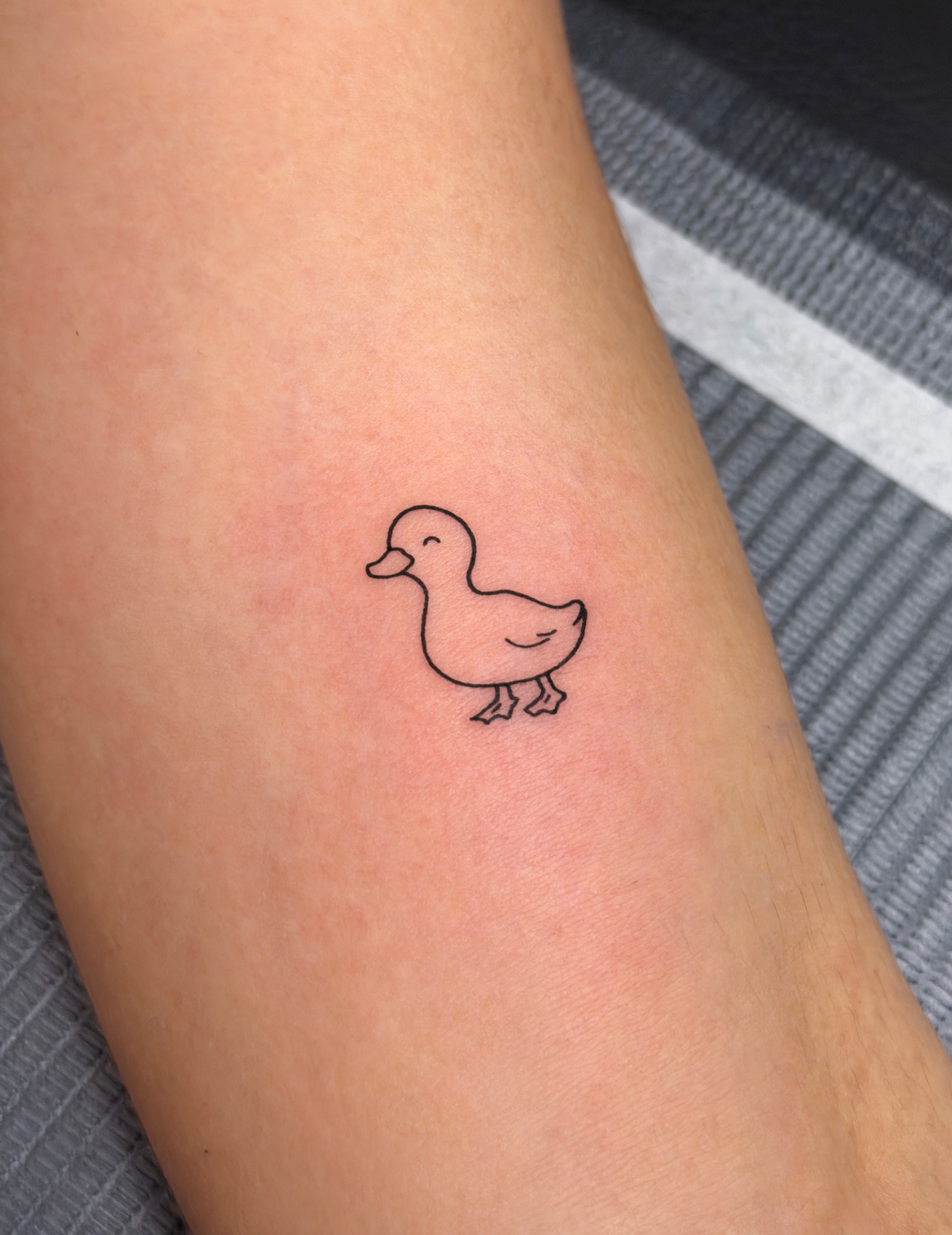 Duck minimalist tattoo on the forearm by Hery Anwar