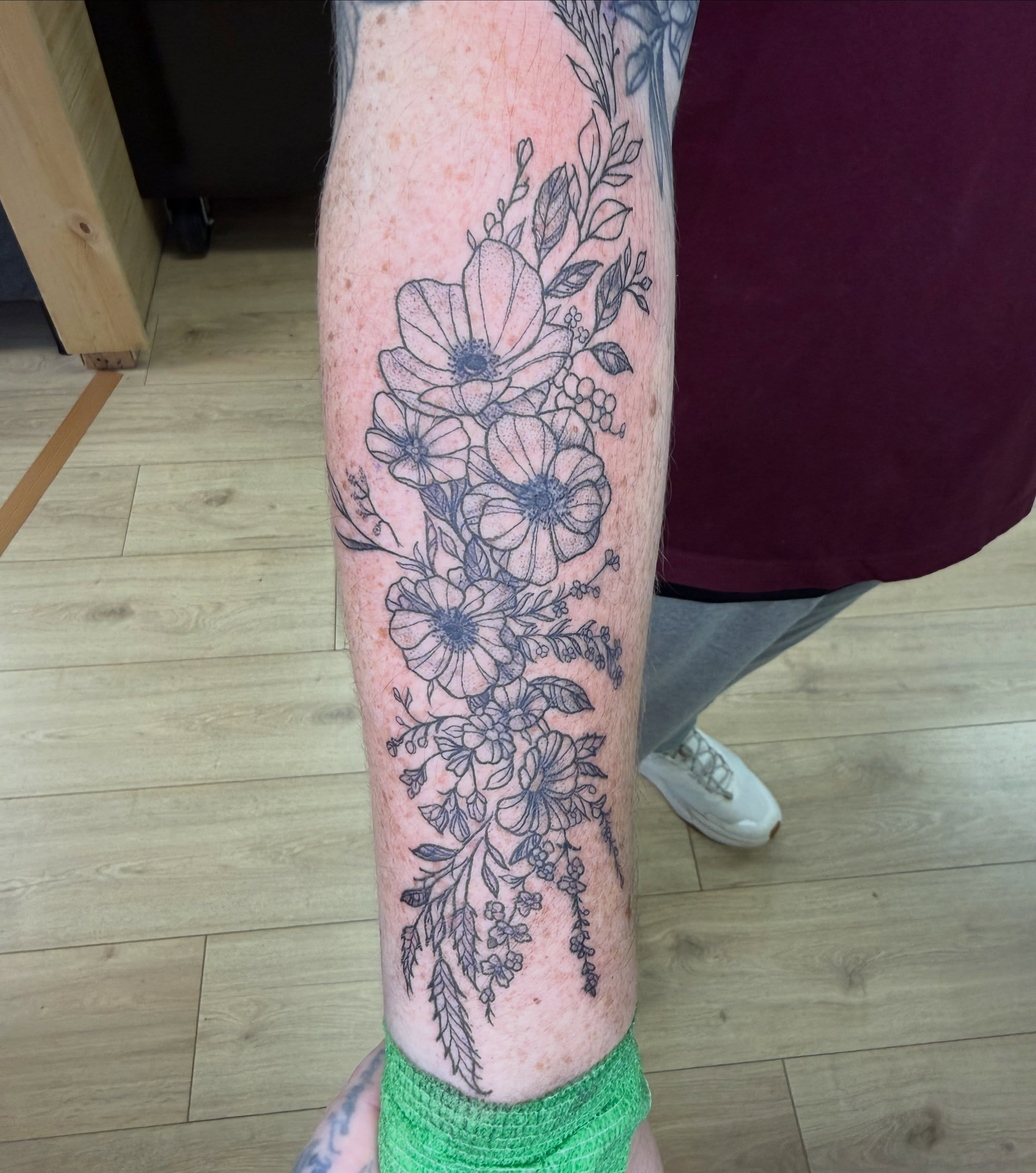 Floral bouquet black and grey tattoo on the forearm by Stvn Geyer, Urbandale, Iowa
