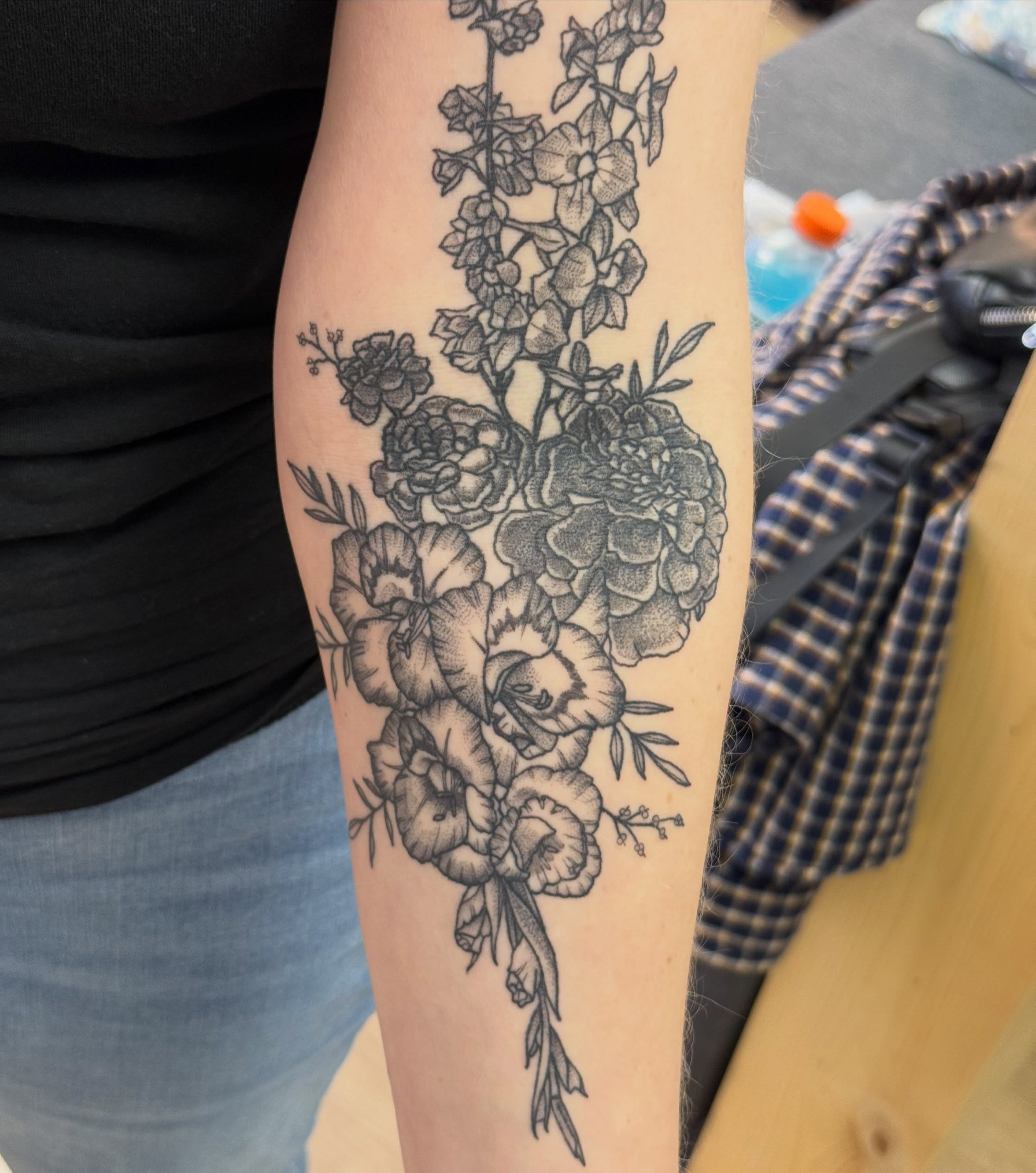 Floral bouquet black and grey tattoo on the forearm by Stvn Geyer, Urbandale, Iowa