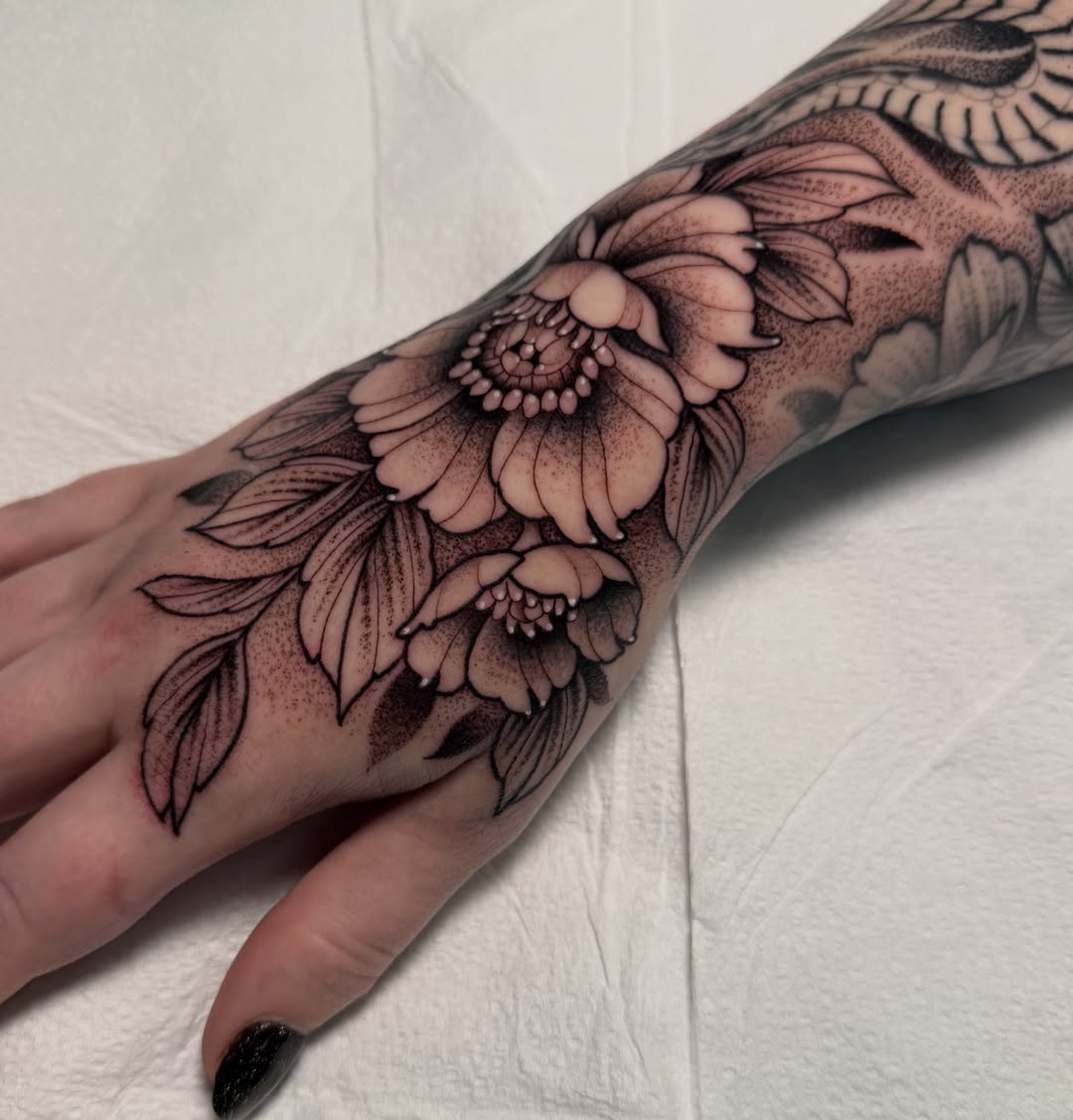 Floral arrangement dotwork tattoo on the forearm by Patrick Whiting