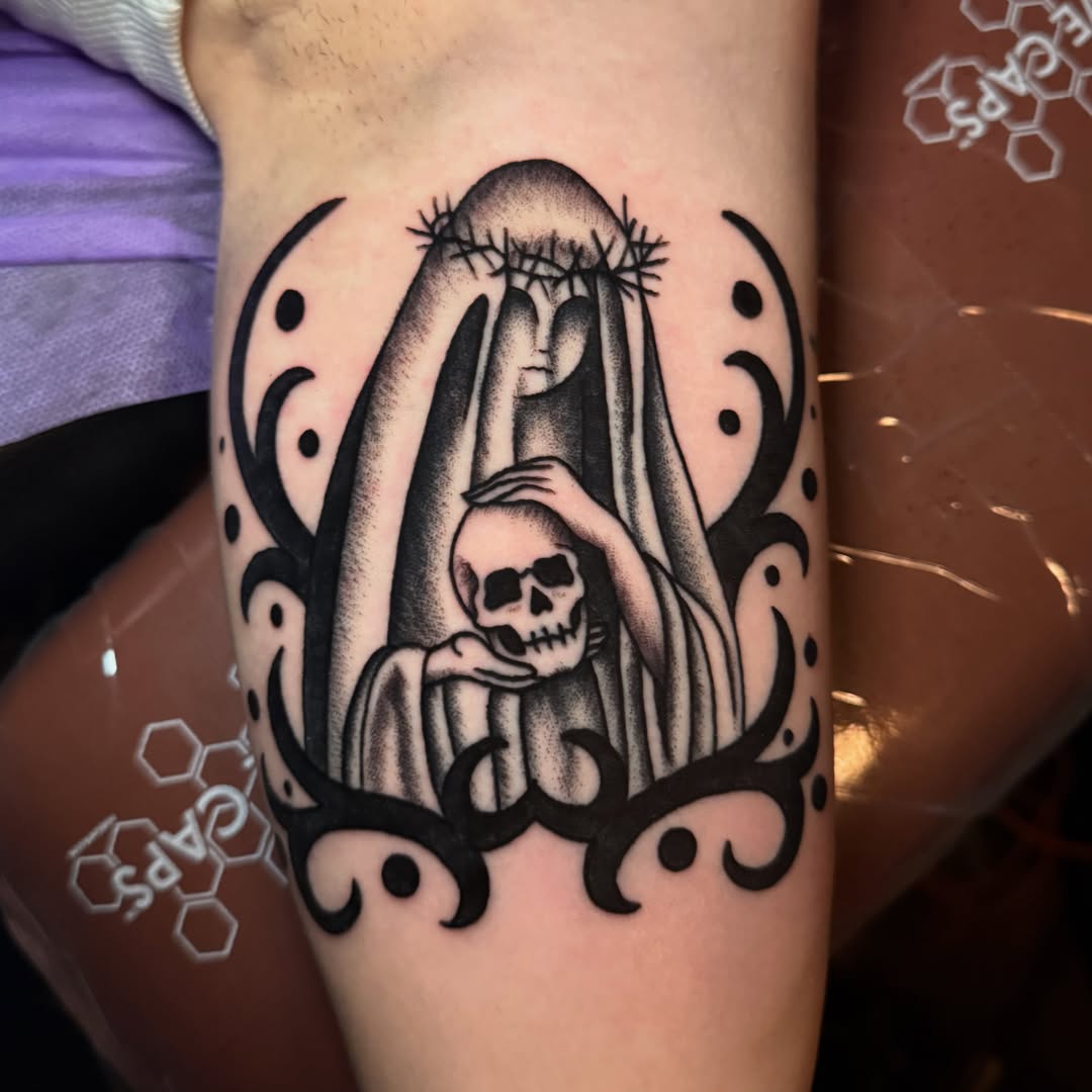 Woman with skull black and grey tattoo on the forearm by Emily Lestrange