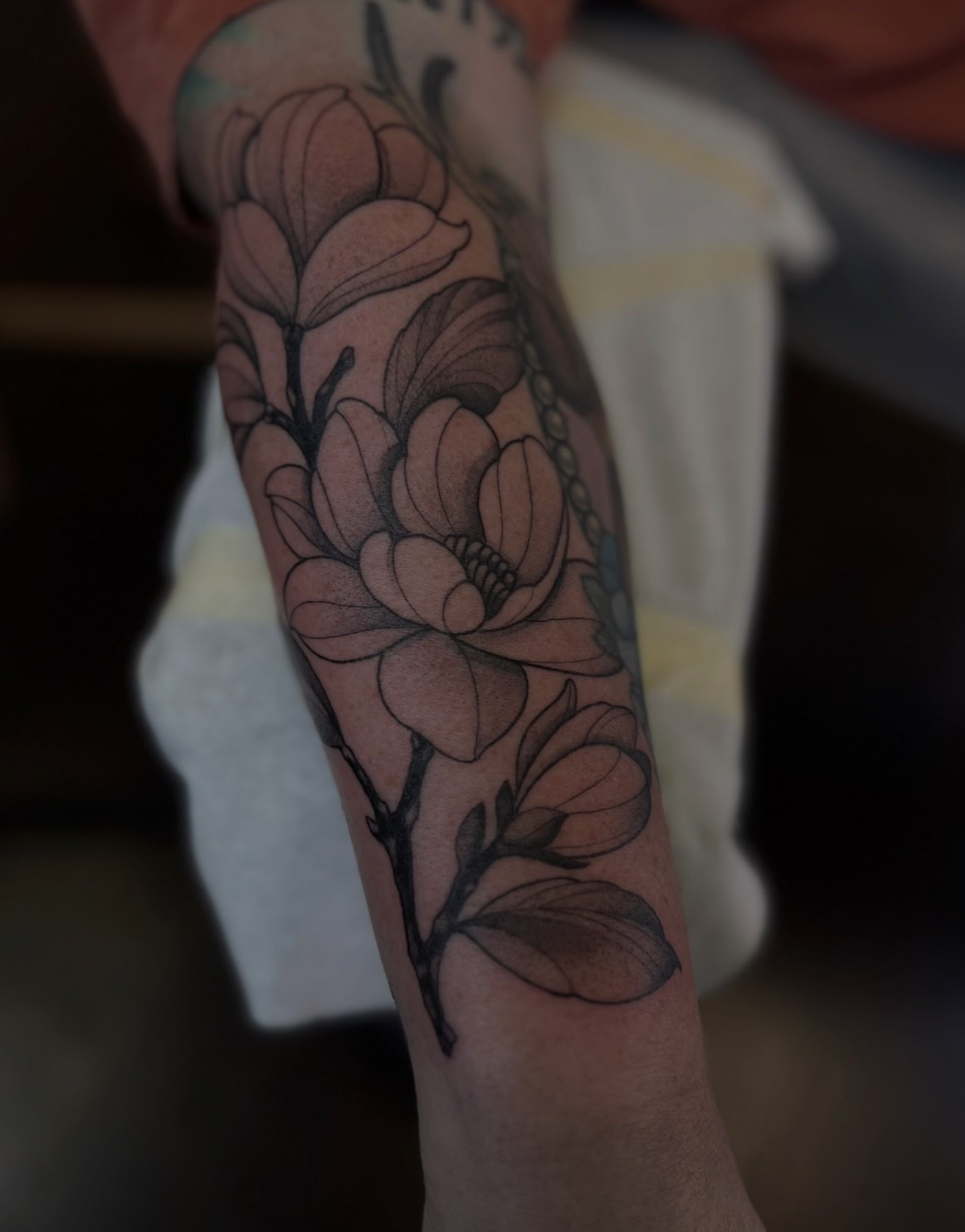 Magnolia flowers black and grey tattoo on the forearm by ✣ Liz Karn ✣