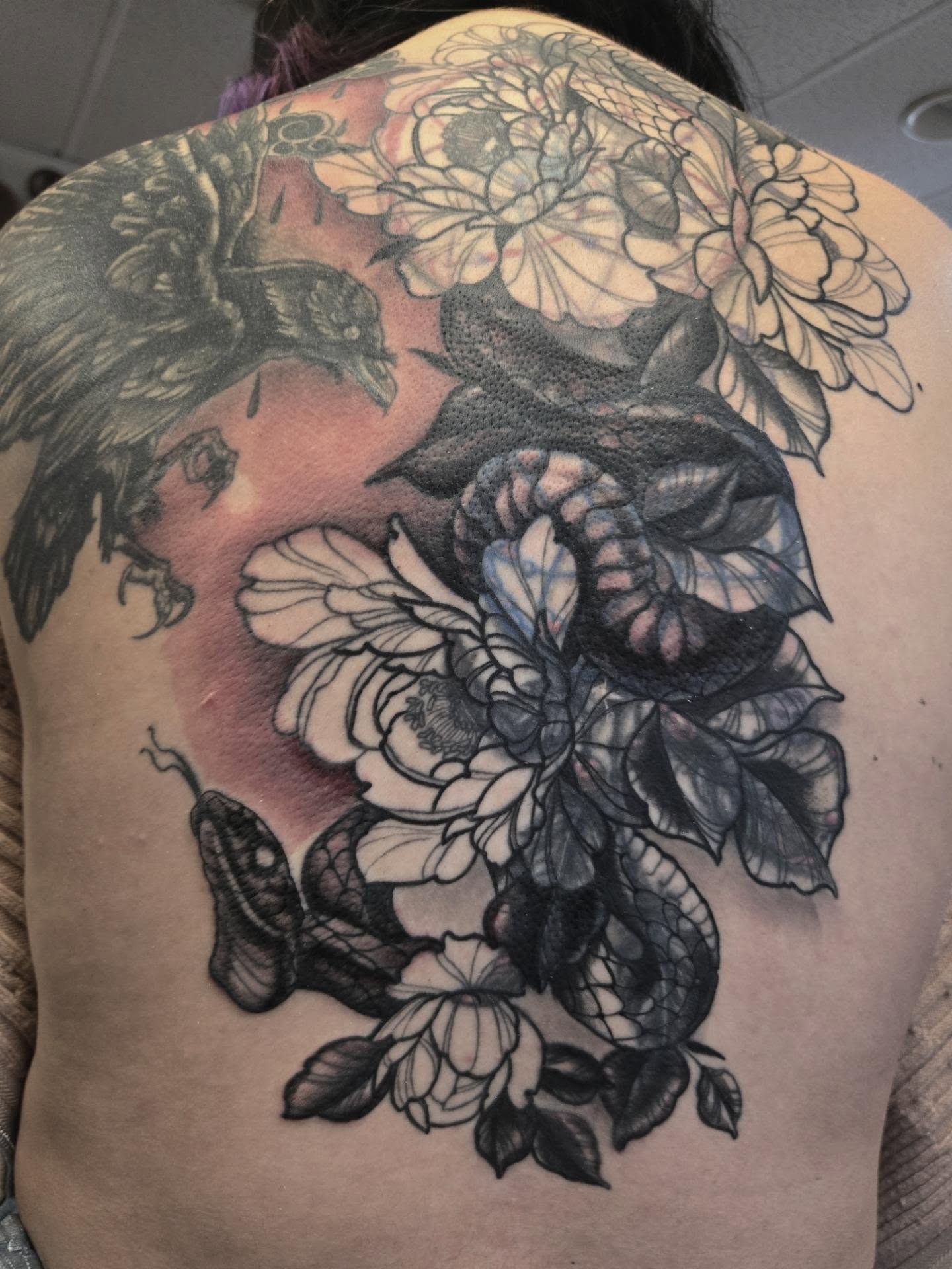 Peony and snake realism tattoo on the back by Irma π€β¨, Las Vegas, Nevada