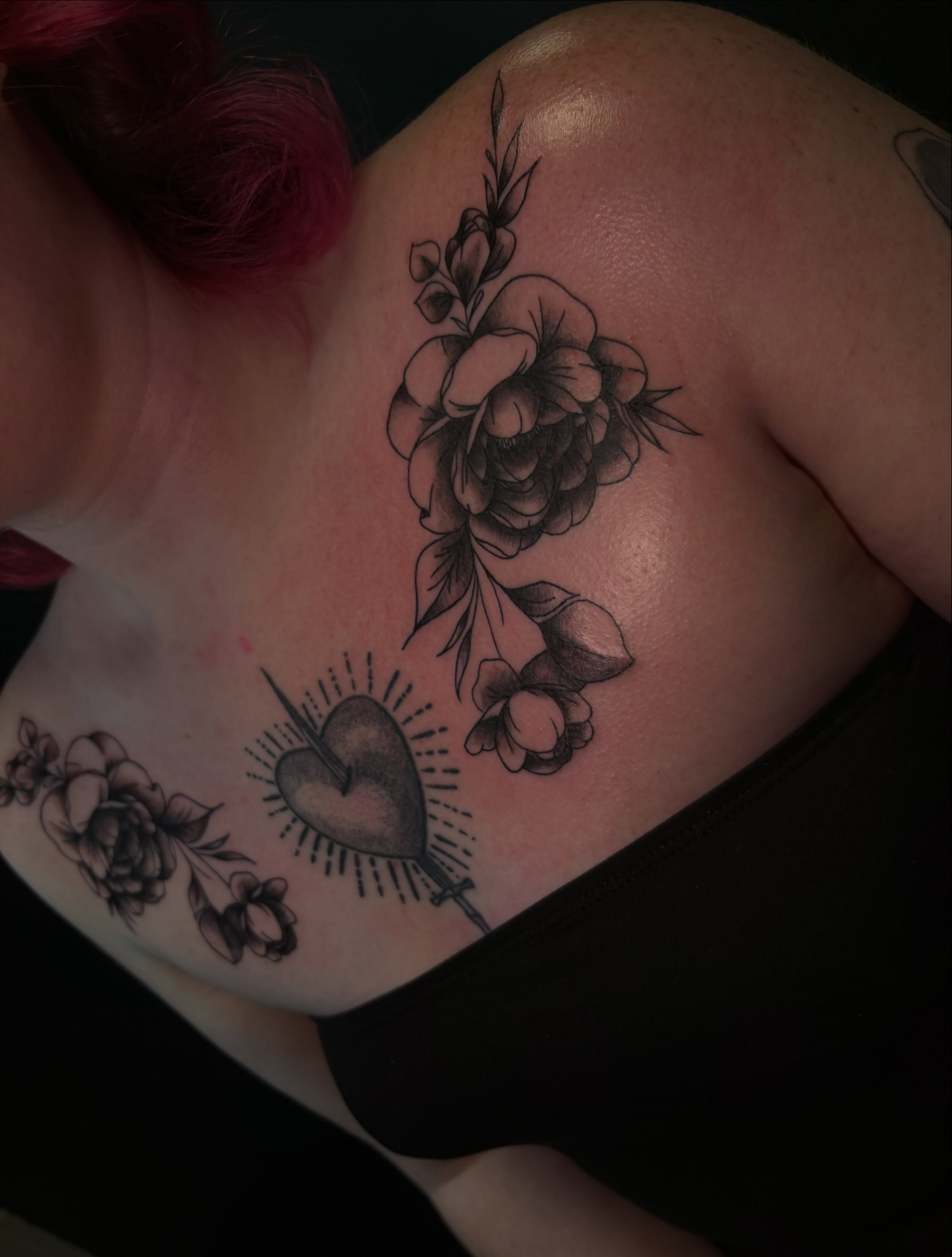 Heart and flowers black and grey tattoo on the shoulder by ⋆.˚ ☾ .⭒˚ alaina