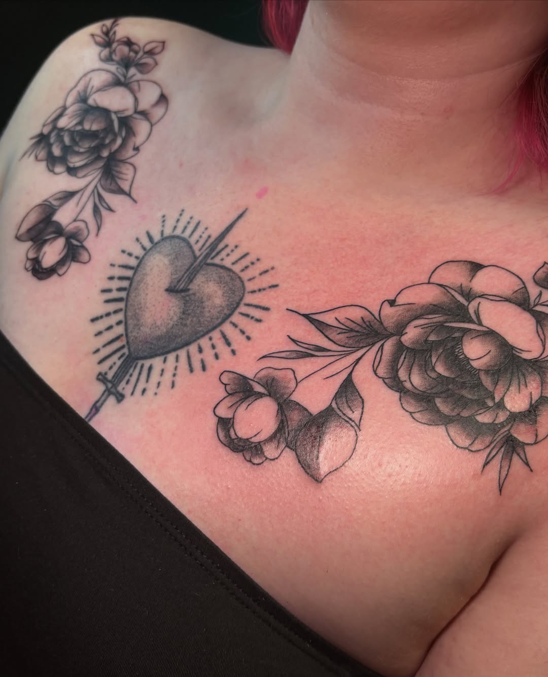 Heart pierced by arrow American traditional tattoo on the chest by ⋆.˚ ☾ .⭒˚ alaina