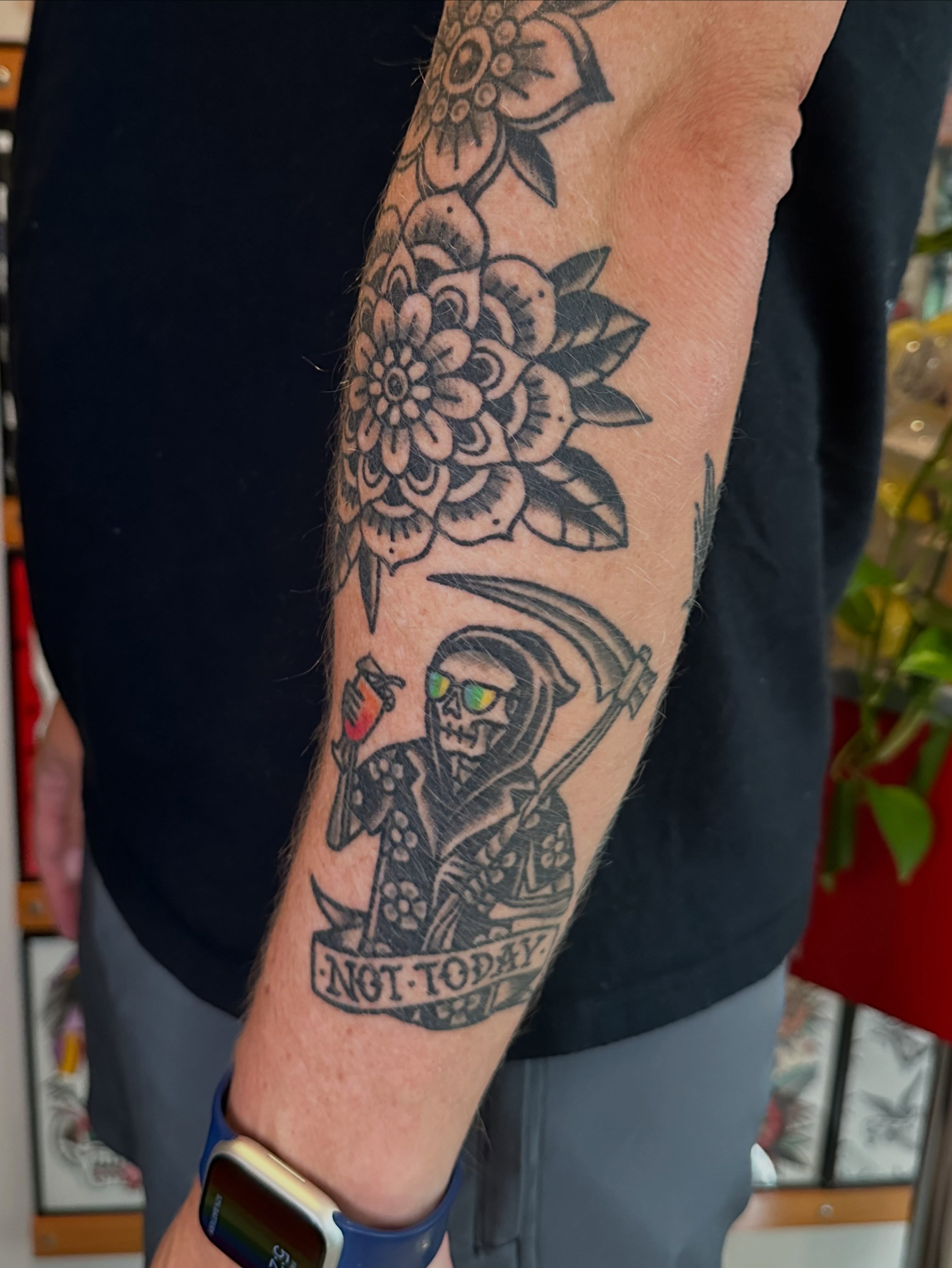 Reaper with sunglasses black and grey tattoo on the forearm by Whitney Creep Tattoos