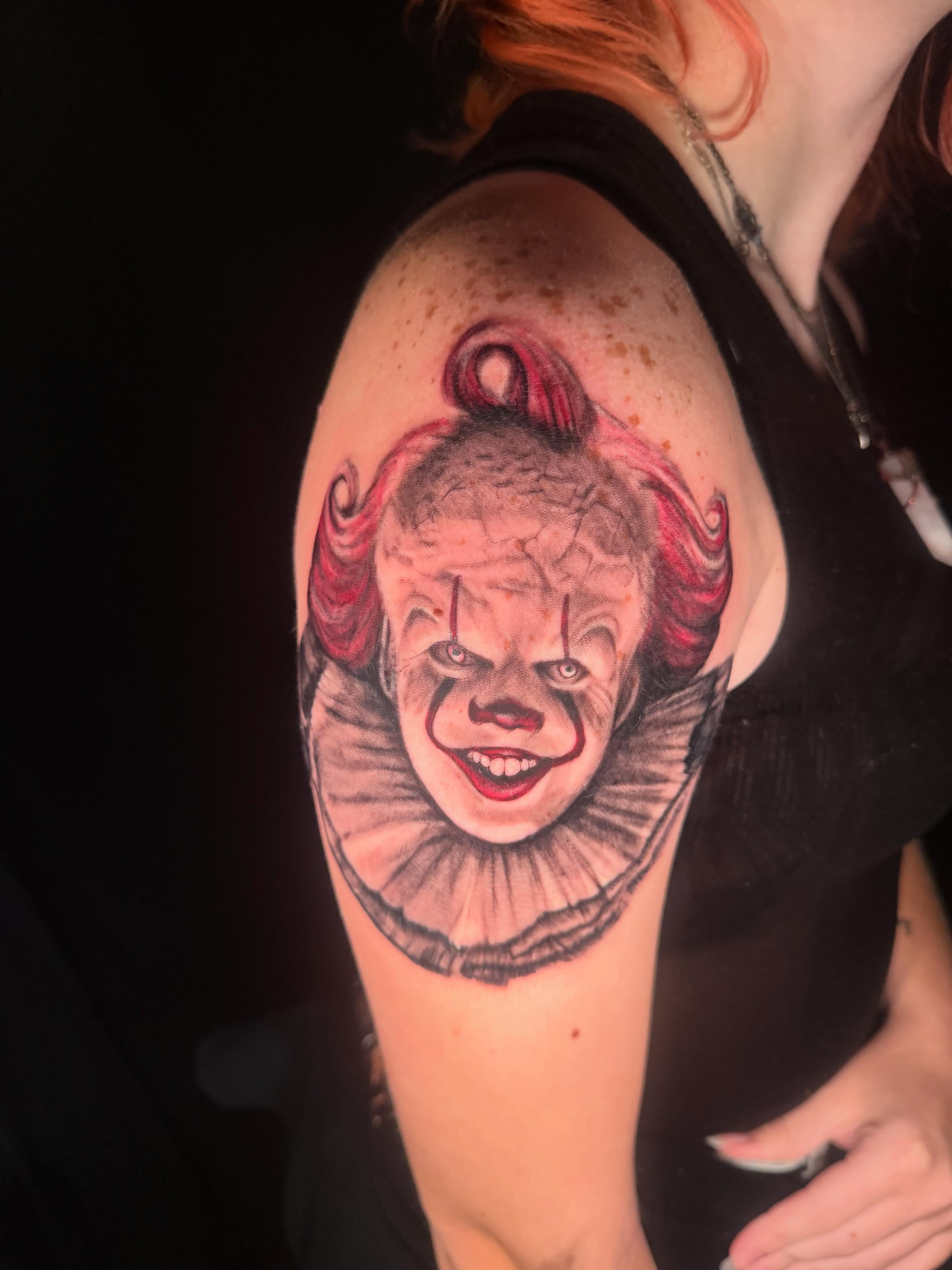 Clown realism tattoo on the shoulder by Hatchetfoot Art