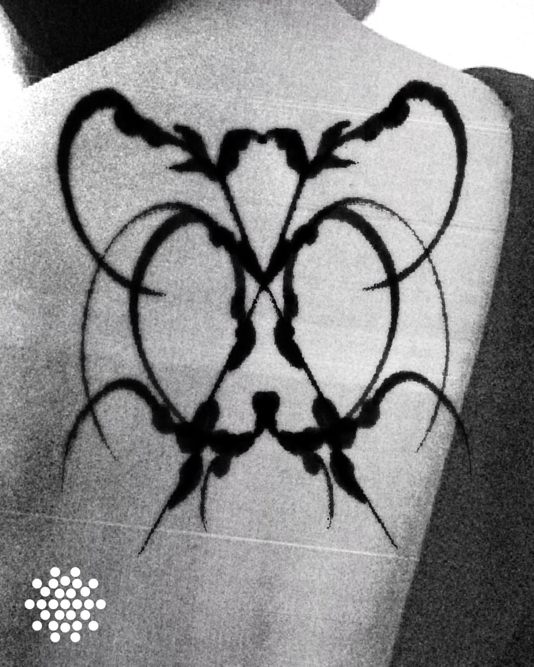 Abstract design black and grey tattoo on the back by San Kang