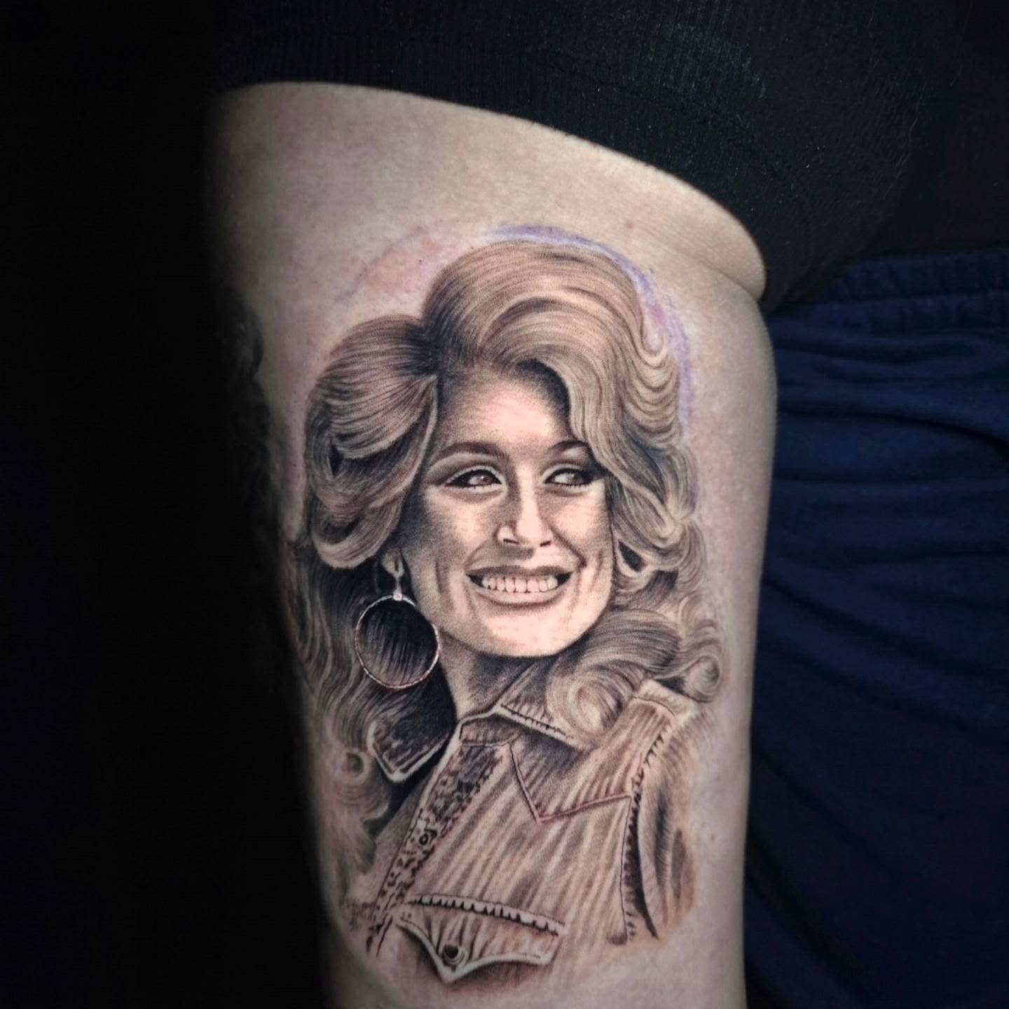 Portrait realism tattoo on the thigh by Anna Brittany
