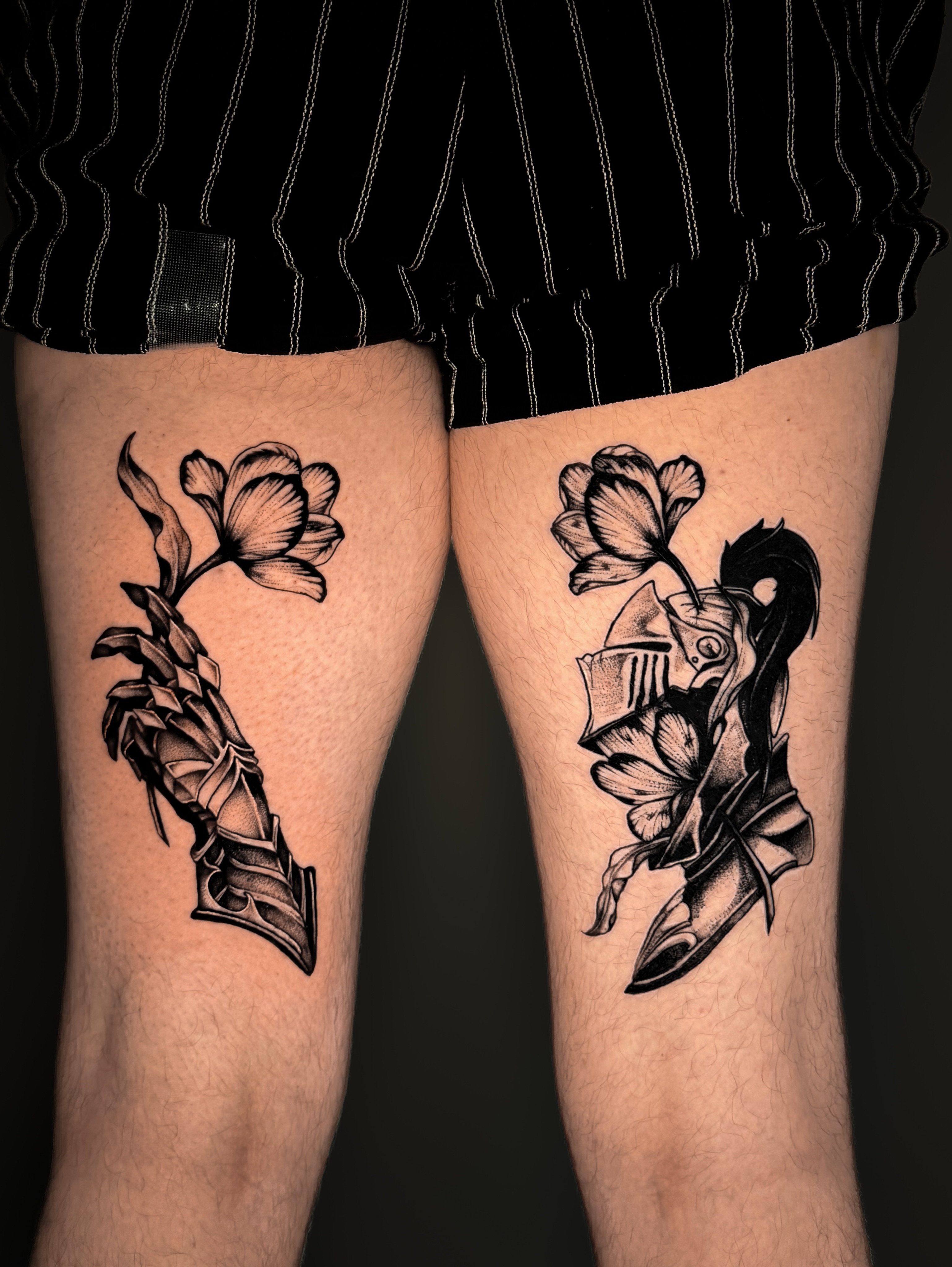Floral dagger black and grey tattoo on the leg by Kam Mills